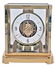 LeCoultre & Cie, Switzerland, "Atmos" clock, 15 jewel gilt caliber 528 movement, gilt torsion pendulum, round white painted dial with applied gilt Arabic numerals and arrow markers, gilt hands, contained in a glazed rectangular case with removable front panel, serial #224079