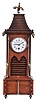 France, for Johs. Hartmann, Berlin, architectural shelf clock in walnut, the base with quoined corners, mid section with louvered lancet arches below the quoined mansard roof with crenellated cornice, gargoyle heads, and crowing cock finial, Roman numeral white enamel dial, blued steel hands, 8 day timepiece movement marked "Z. & Co. Paris"