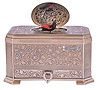Mechanische Musikwerke Manufaktur, (MMM), Germany, singing bird box, the foliate engraved sterling silver case with canted corners, and a small drawer in the base, top with oval cover concealing a bird with brightly colored feathers, appearing and performing on demand, late 20th century