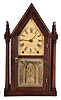 Brewster & Ingrahams, Bristol, Conn., 8 day, time and strike spring brass movement 4- column sharp gothic or steeple clock.