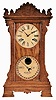 Ithaca Calendar Clock Co., Ithaca, NY, "Mantel Index" shelf clock with 8 day spring driven time and half hour strike movement with a perpetual calendar clock mechanism in an oak case.