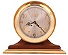 Chelsea Clock Co., Boston, Mass., "Third Millennium Limited Edition 2000" ship's bell mantel clock with 8 days, spring driven, time and ship's bell strike movement in polished brass case on walnut base with brass platform engraved with the greatest names of the second millennium. The dial is silvered metal with applied brass numerals and "MM", serial #2011, including original box and paperwork