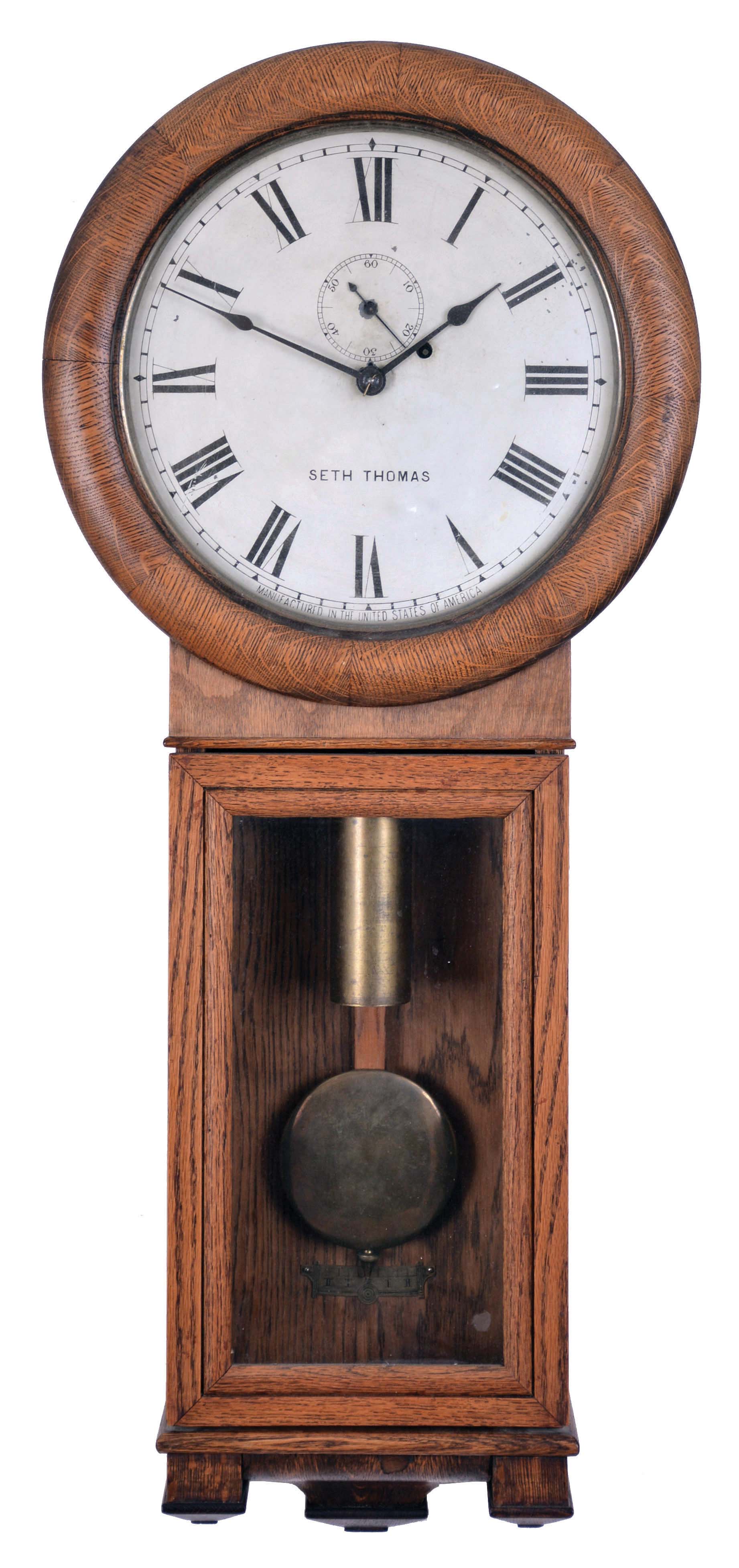 Seth Thomas Clock Co., Thomaston, Conn., "Regulator No. 2" wall clock with a weight driven, 8 day timepiece movement in an oak case, railway ID — Antique Clocks Price Guide
