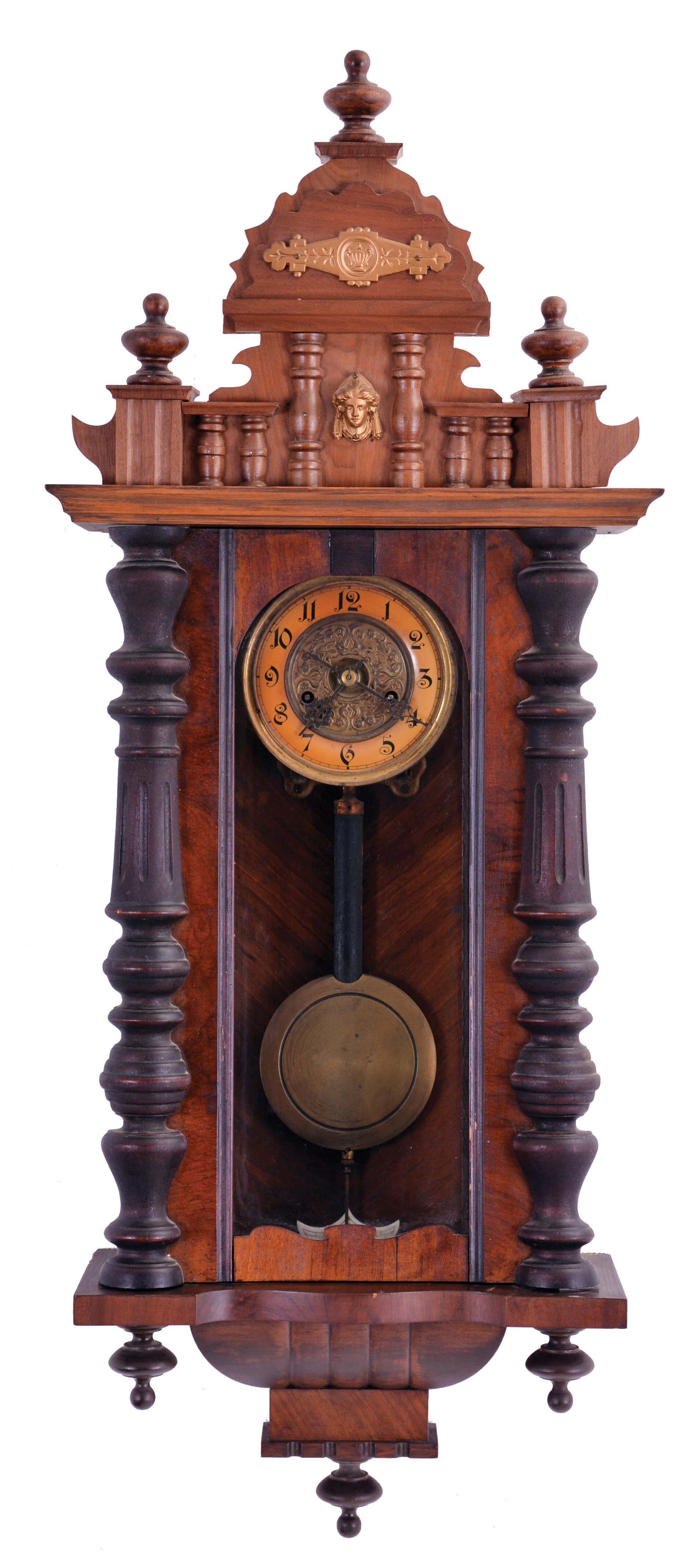 Clocks- 2 (Two): (1) an 8 day, time and strike, spring Vienna, hardwood case with turned ornament, Arabic numeral dial and brass pendulum; (2) a Gustav Becker "Freischwinger", walnut cased, with turned and carved ornaments, Arabic numeral square brass dial (uncommon) 8 day, time and strike movement — Antique Clocks Price Guide