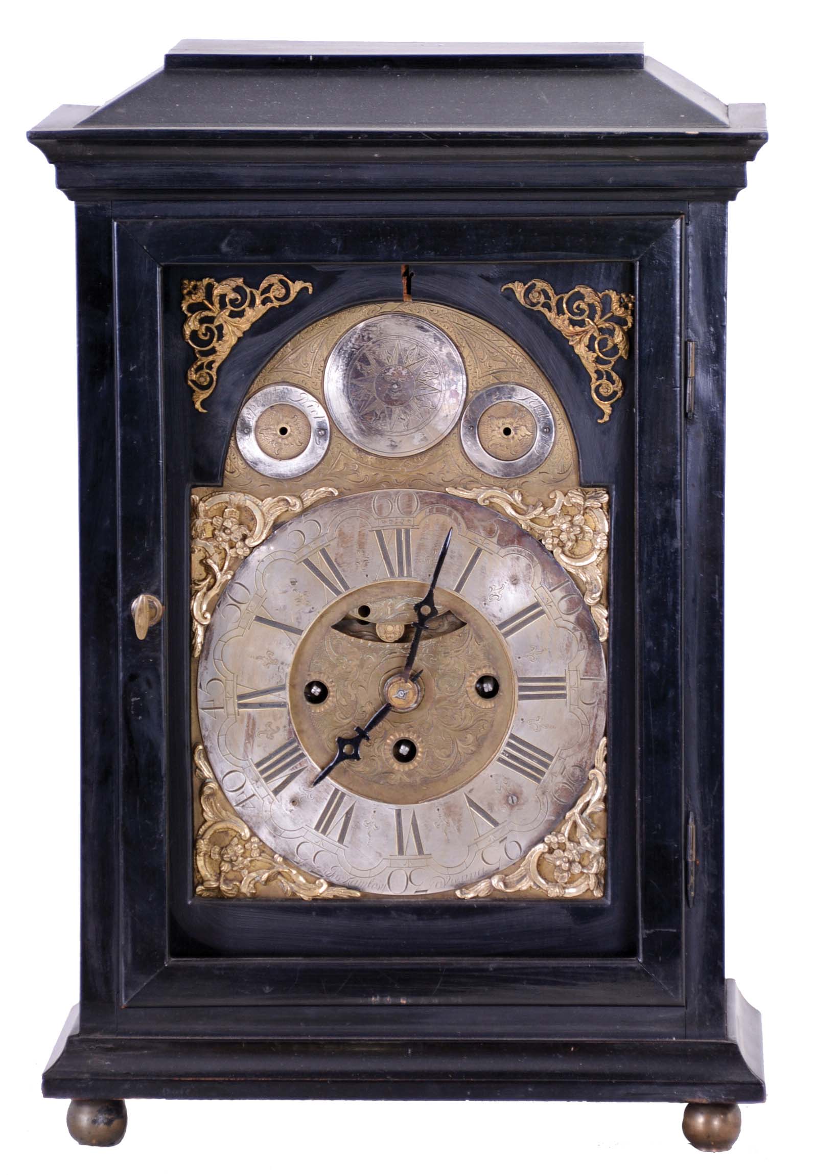 Clocks- 2 (Two): The first an ebonized, three train Austrian bracket clock with mock pendulum, Joseph Kamlosy, ebonized rectilinear case on brass ball feet, composite dial with Roman numeral, arcaded chapter ring, brass movement with verge escapement, striking the full quarters on two bells, c1785, the other possibly Swiss, rosewood case with painted decoration and brass trim, Roman numeral white enamel dial, unusual brass fusee timepiece movement with pinwheel escapement employing a steel cylinder from which the pallets are formed, c1800, bracket clock dimensions given — Antique Clocks Price Guide