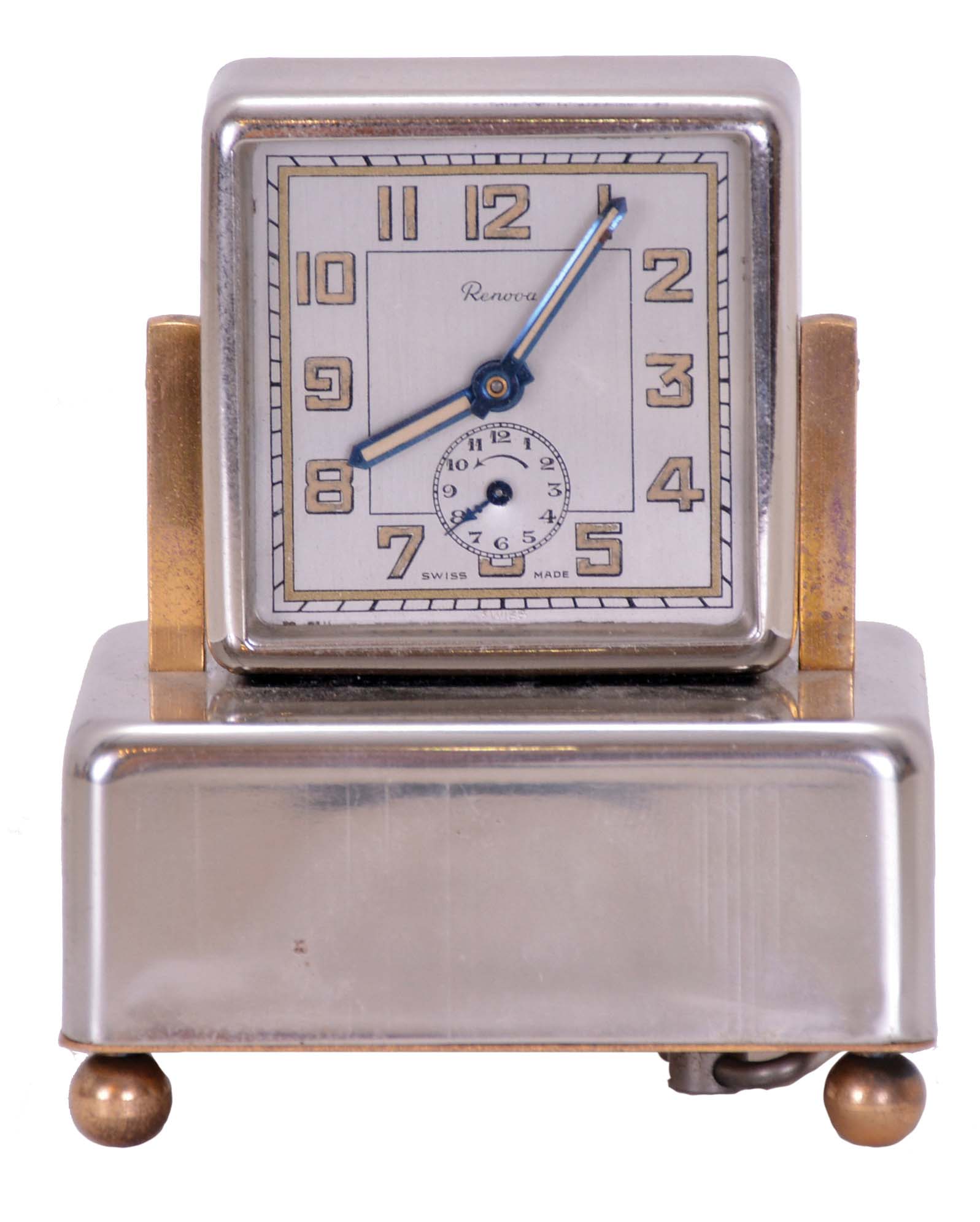 Renova, Switzerland, a nickel plated, musical alarm clockthe rectilinear case on ball feet, Arabic numeral metal dial, blued steel luminous baton hands, 30 hour timepiece movement with music box concealed in the base — Antique Clocks Price Guide
