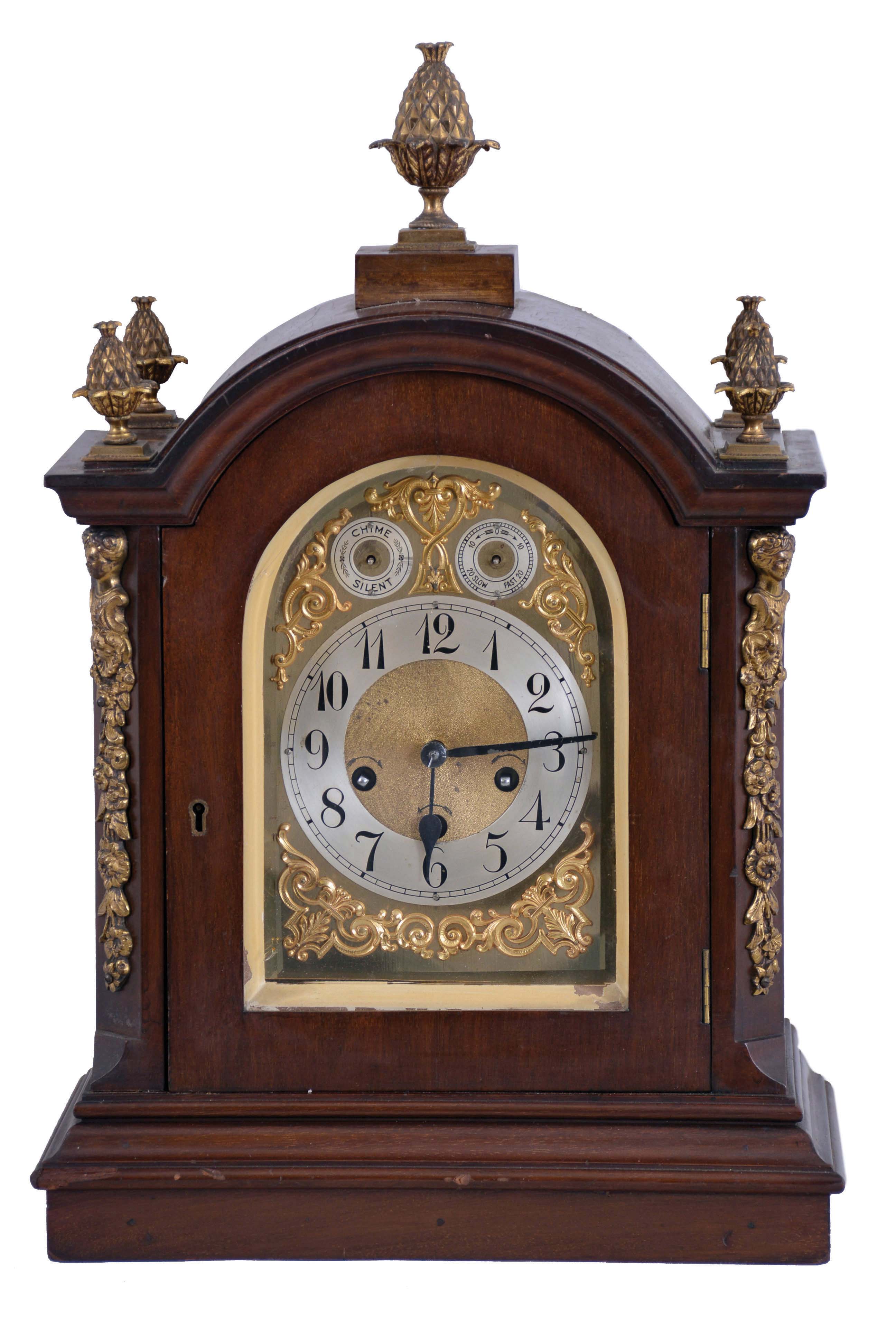 Germany, Junghans, 8 day, Westminster Chime, mahogany cased Georgian style bracket clock with fancy arched dial and pineapple finials — Antique Clocks Price Guide