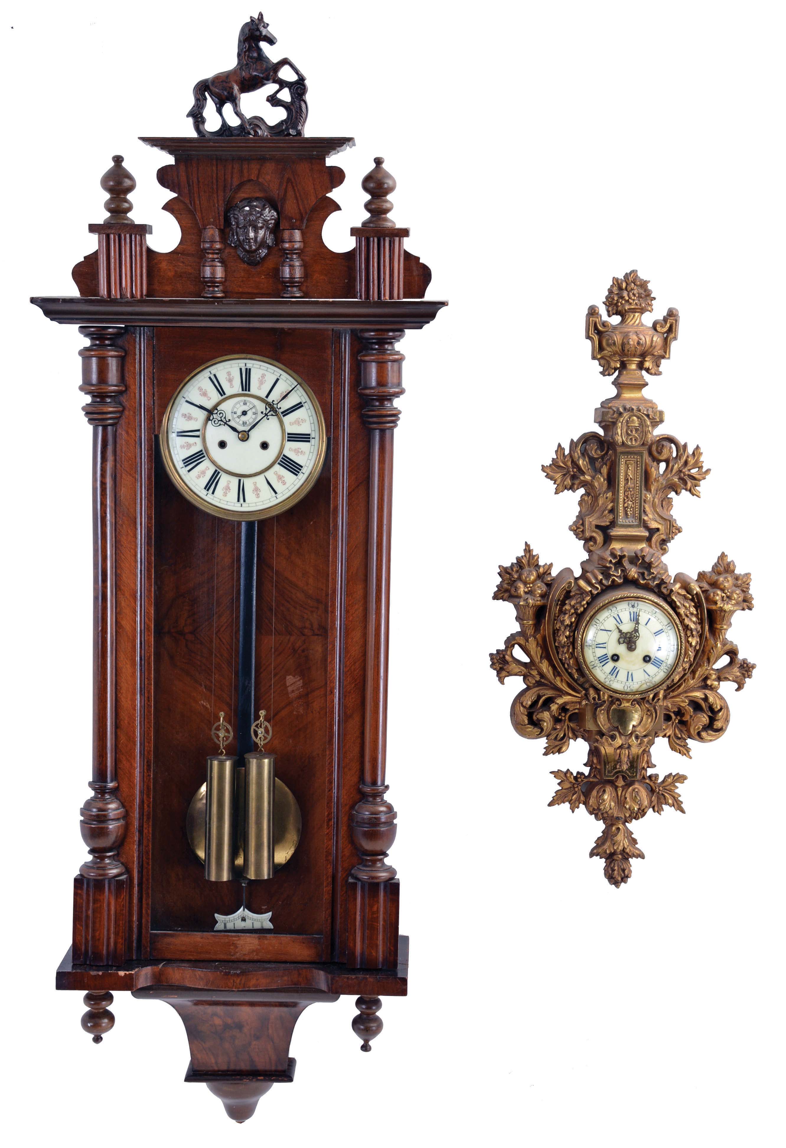 Clocks- 2 (Two) Continental wall clocks: (1) Vienna regulator, 8 day, time and strike, weight driven movement in a walnut case; (2) French cartel clock, time and strike in a brass case — Antique Clocks Price Guide