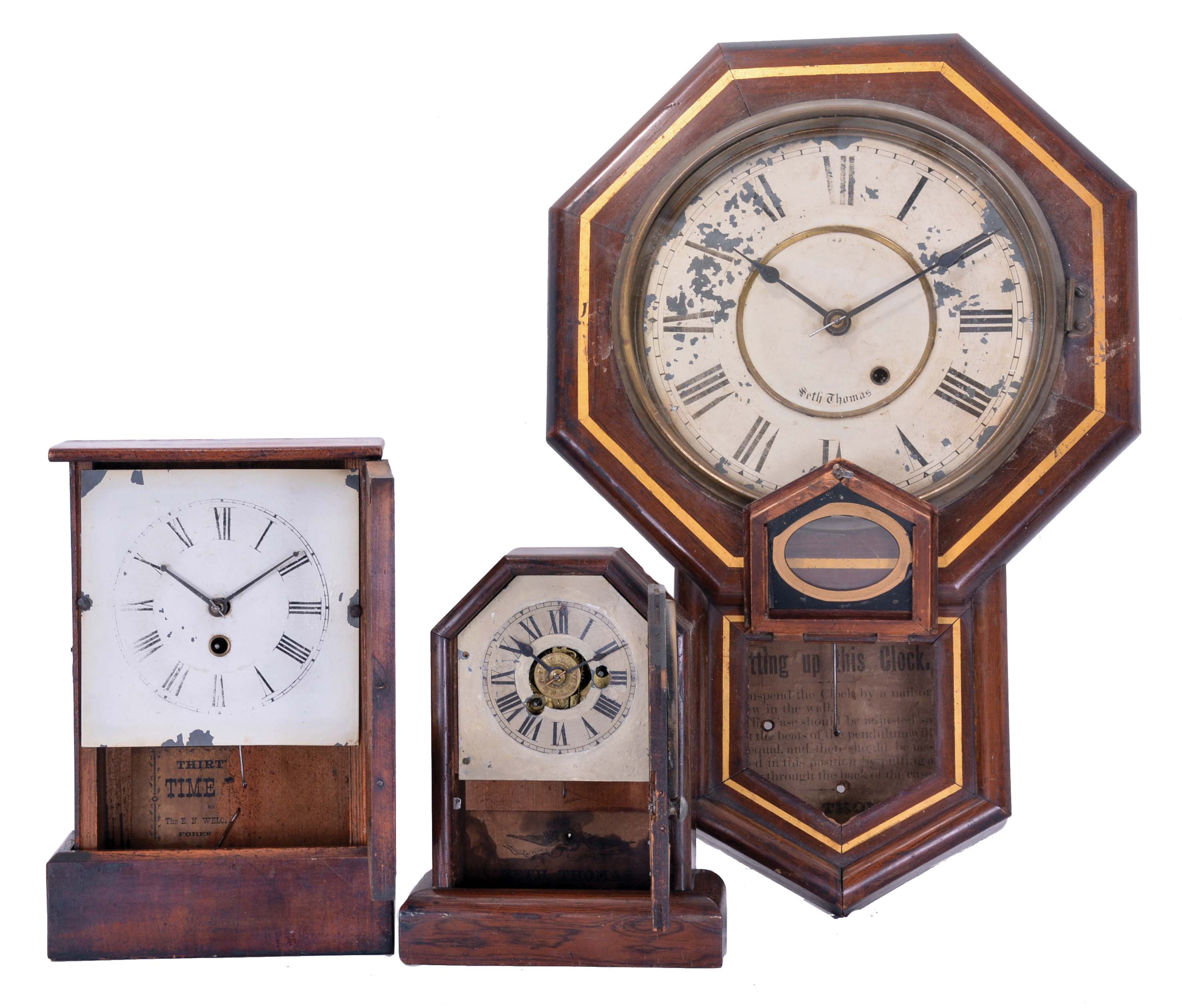 Clocks- 3 (Three): (1) Seth Thomas Clock Co., Thomaston, Conn., 8 day, spring driven movement drop octagon wall timepiece, c1910; (2) E. N. Welch Mfg. Co., Forestville, Conn., 30 hour, spring driven movement cottage timepiece, c1850; (3) Seth Thomas Clock Co., Thomaston, Conn., 30 hour, spring driven movement cottage timepiece, c1870 — Antique Clocks Price Guide