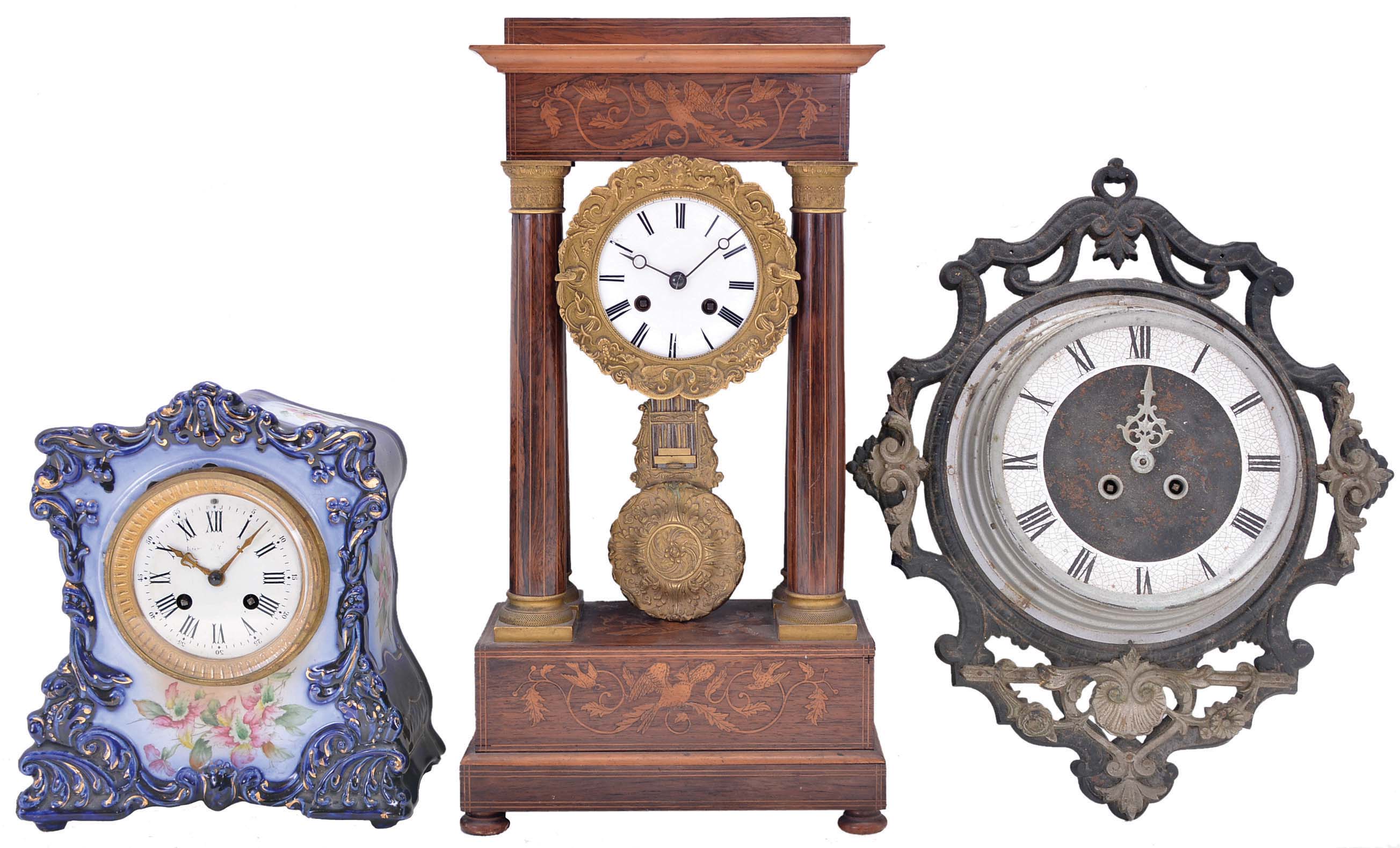 Clocks- 3 (Three) French time and strike clocks: (1) porcelain case with Marti count wheel and bell striking movement; (2) wood case portico clock marquetry and detailed case bezel and pendulum with bell striking movement and white enamel dial both; (3) cast iron wall clock with Japy Freres movement which strikes on a gong. — Antique Clocks Price Guide
