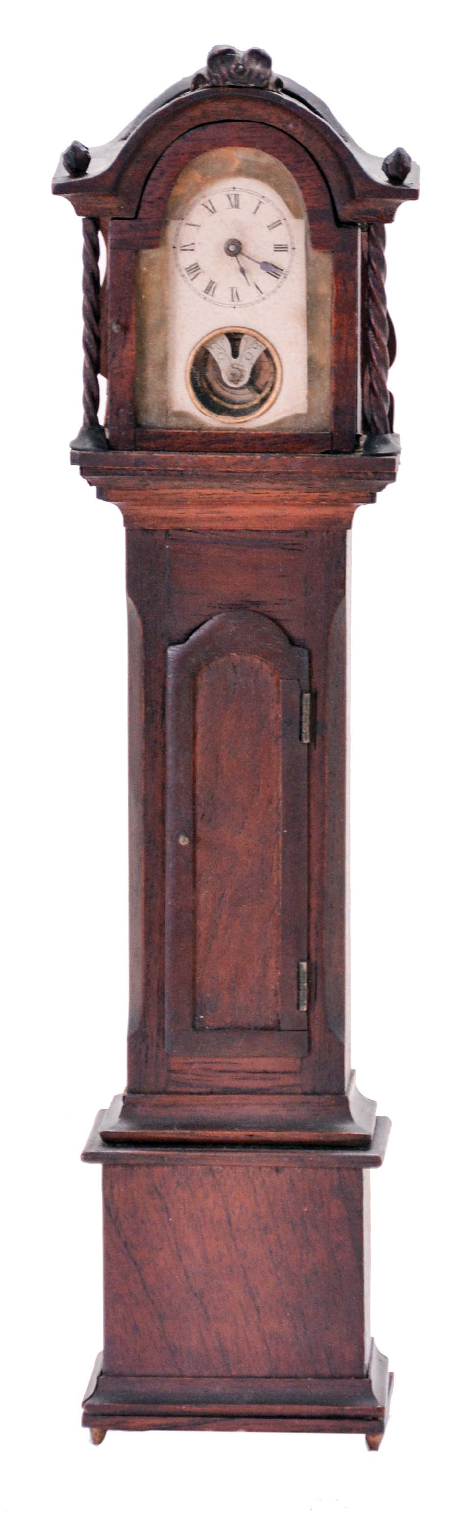Miniature tall clock, mahogany case with removable bonnet, applied moldings, twist turned columns, and carved finials, Roman numeral paper dial with aperture below revealing the oscillating balance, 30 hour timepiece movement by the Yale Clock Co. — Antique Clocks Price Guide