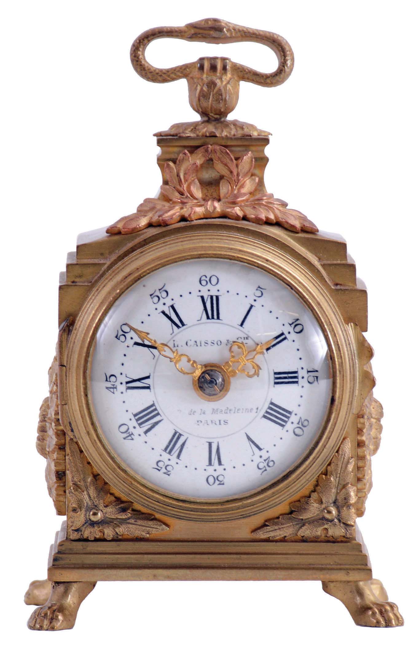 L. Caisso & Cie., Paris, desk or bedside clock, miniature pendule de officier style gilt case with applied ornament, Roman numeral convex white enamel dial, gilt Louis XV style hands, 8 day, key wound timepiece movement with cylinder platform — Antique Clocks Price Guide