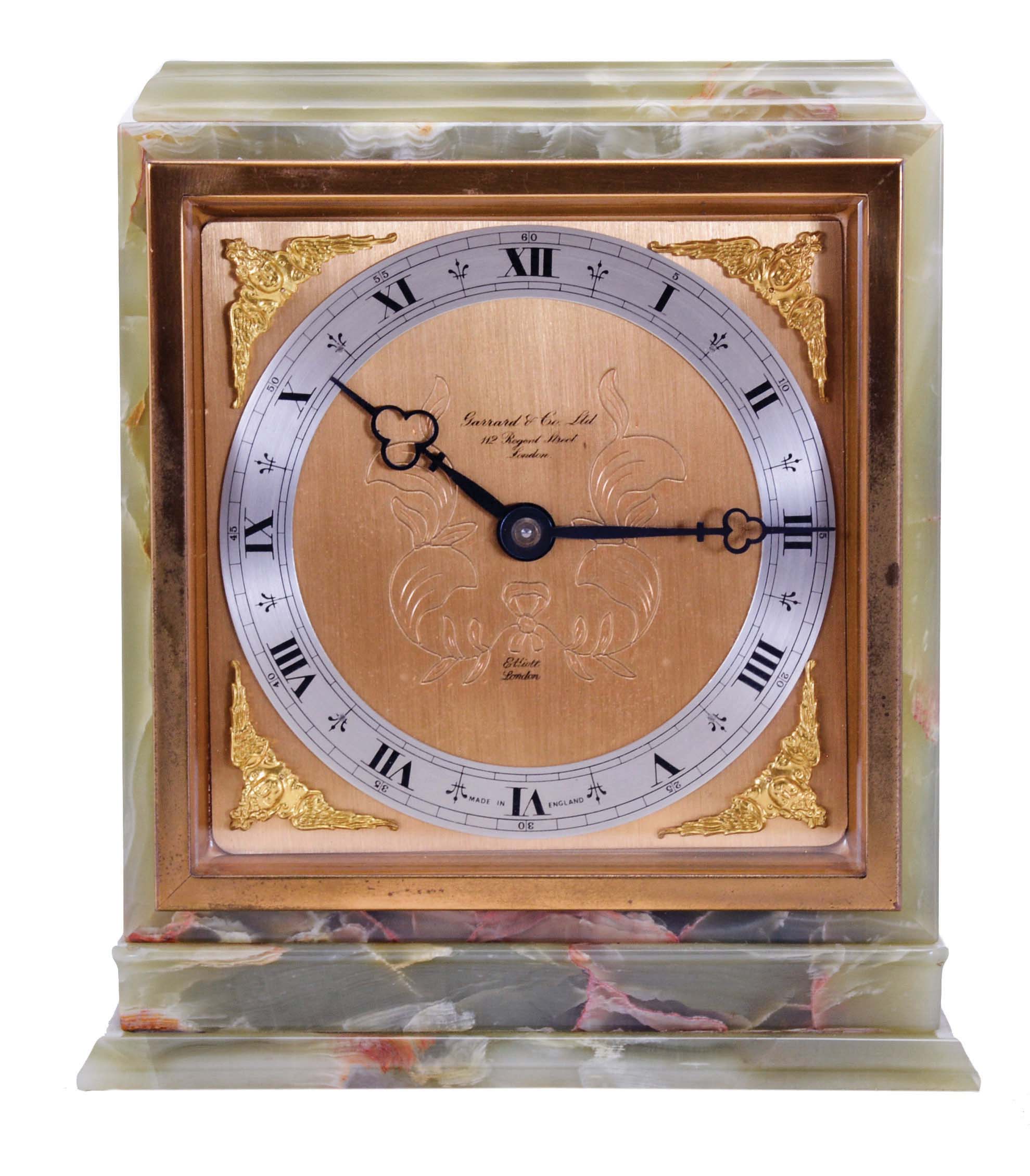 Elliott, London, for Garrard & Co., Ltd., shelf clock, rectilinear green onyx case with gilt bezel, gilt composite dial, blued steel trefoil hands, 8 day timepiece movement with lever escapement — Antique Clocks Price Guide