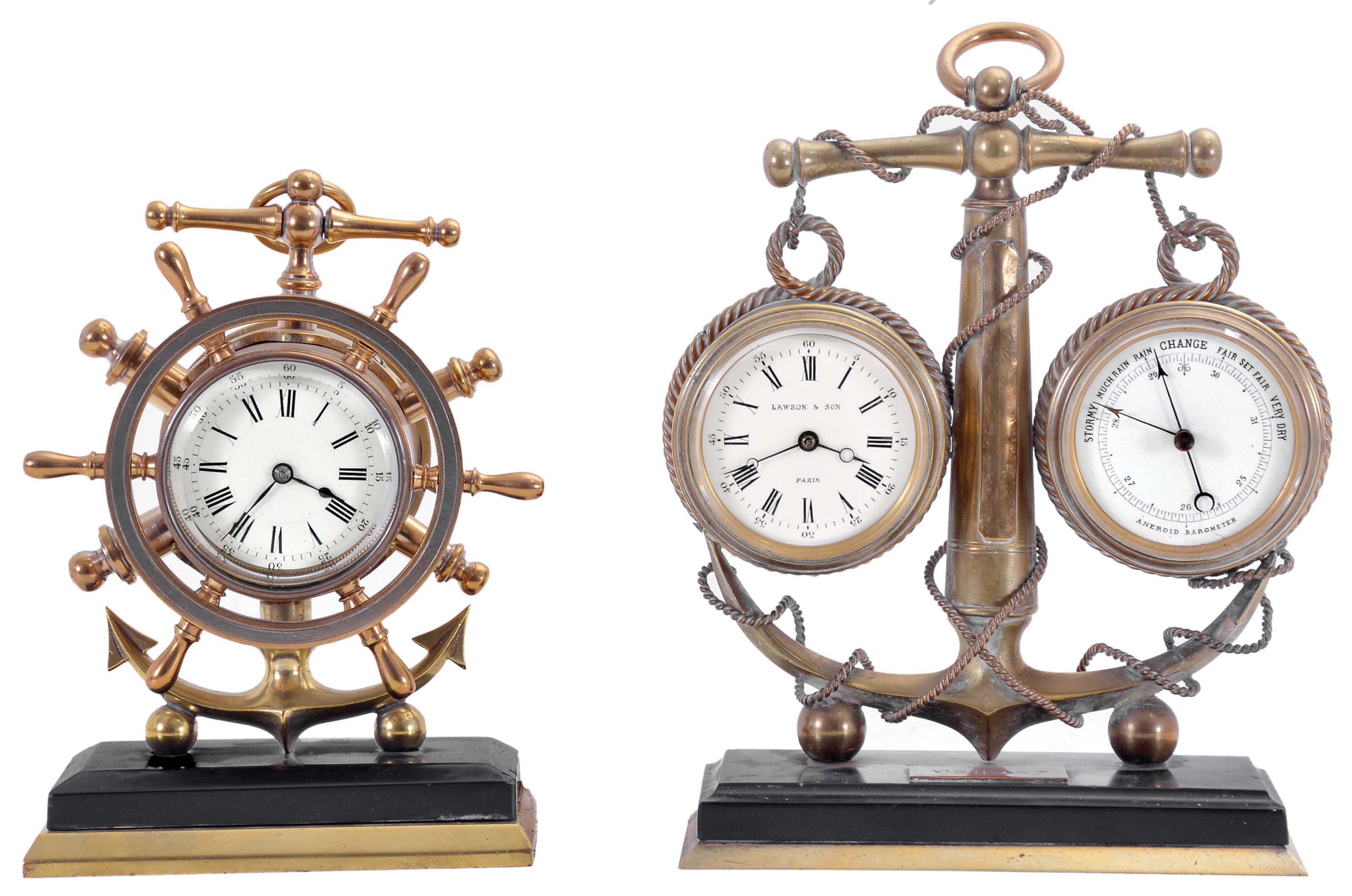 Clocks- 2 (Two): Both with nautical theme, the first signed "Lawson & Son Paris", brass trimmed, black slate base supporting a brass anchor encircled by rope, and with 8 day timepiece and barometer, both with white enamel dials, and rectangular plaque engraved "Vigilant", the other also with brass trimmed, black slate base supporting a brass anchor and 8 day timepiece with white enamel dial, the bezel with ships wheel surround, dimensions of larger piece listed — Antique Clocks Price Guide