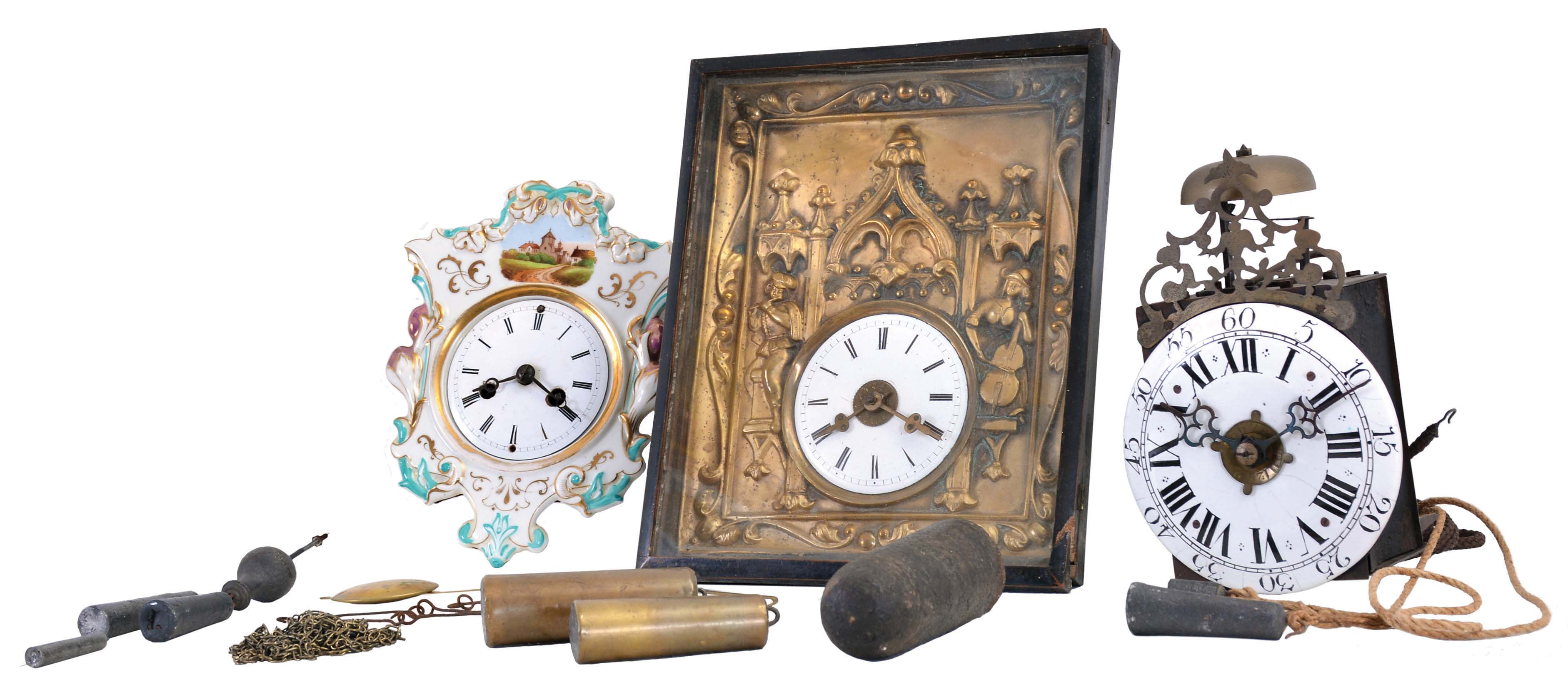 Clocks- 3 (Three): (1) a diminutive Morbier movement in sheet iron case, Roman numeral enamel dial, 30 hour, weight driven time and alarm movement; (2) a German picture frame clock, ebonized frame, stamped brass dial surround with Gothic arches and musicians, Roman numeral white enamel dial, 30 hour, weight driven time, strike, and alarm movement; (3) German shield clock, porcelain front with enamel landscape and foliate ornament, Roman numeral white enamel dial, 30 hour, spring driven time and strike movement, dimensions of picture frame clock listed — Antique Clocks Price Guide
