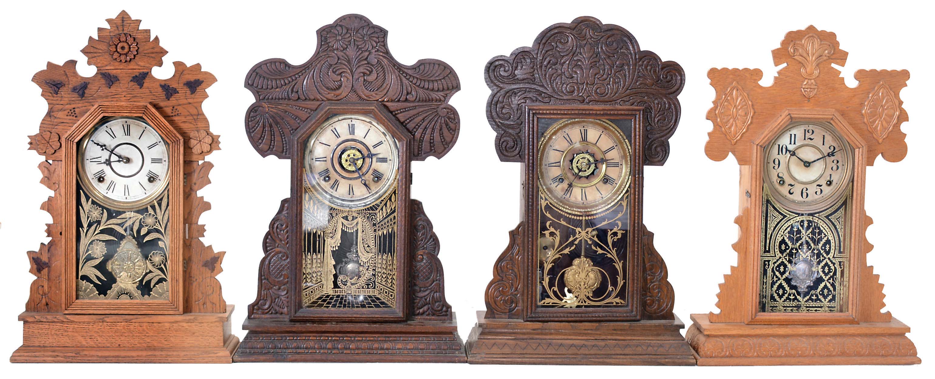 Clocks- 4 (Four): (1) E. Ingraham & Co., Bristol, Conn., unidentified model shelf clock with a spring driven, 8 day, time and strike movement in an oak case, c1895; (2) Wm. L. Gilbert Clock Co., Winsted, Conn., "Dove" shelf clock with a spring driven, 8 day, time and strike movement in an oak case, c1900; (3) The E. Ingraham & Co., Bristol, Conn., unidentified model shelf clock with a spring driven, 8 day, time and strike movement in a oak case, c1915; (4) Waterbury Clock Co., Waterbury, Conn., "Henshaw" shelf clock with a spring driven, 8 day time, strike and alarm movement in an oak case, c1906. — Antique Clocks Price Guide