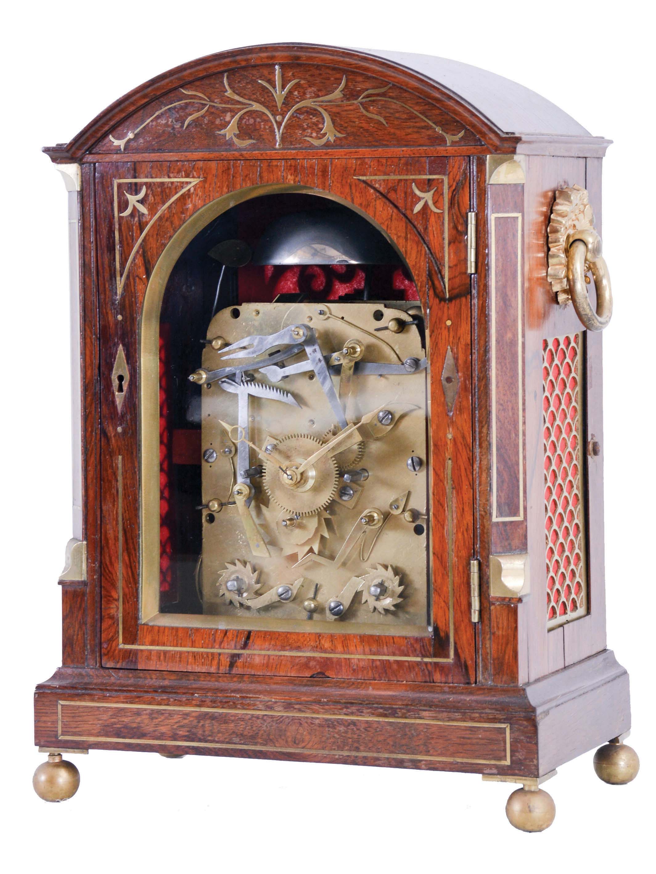 Frodsham, Gracechurch St., London, bracket clock, rosewood veneered, arch top case with brass inlay and furniture, rear door with decorative, scroll cut fret, sheet iron dial plate, well finished 8 day, two train movement, striking the hours in passing, and repeating on demand — Antique Clocks Price Guide