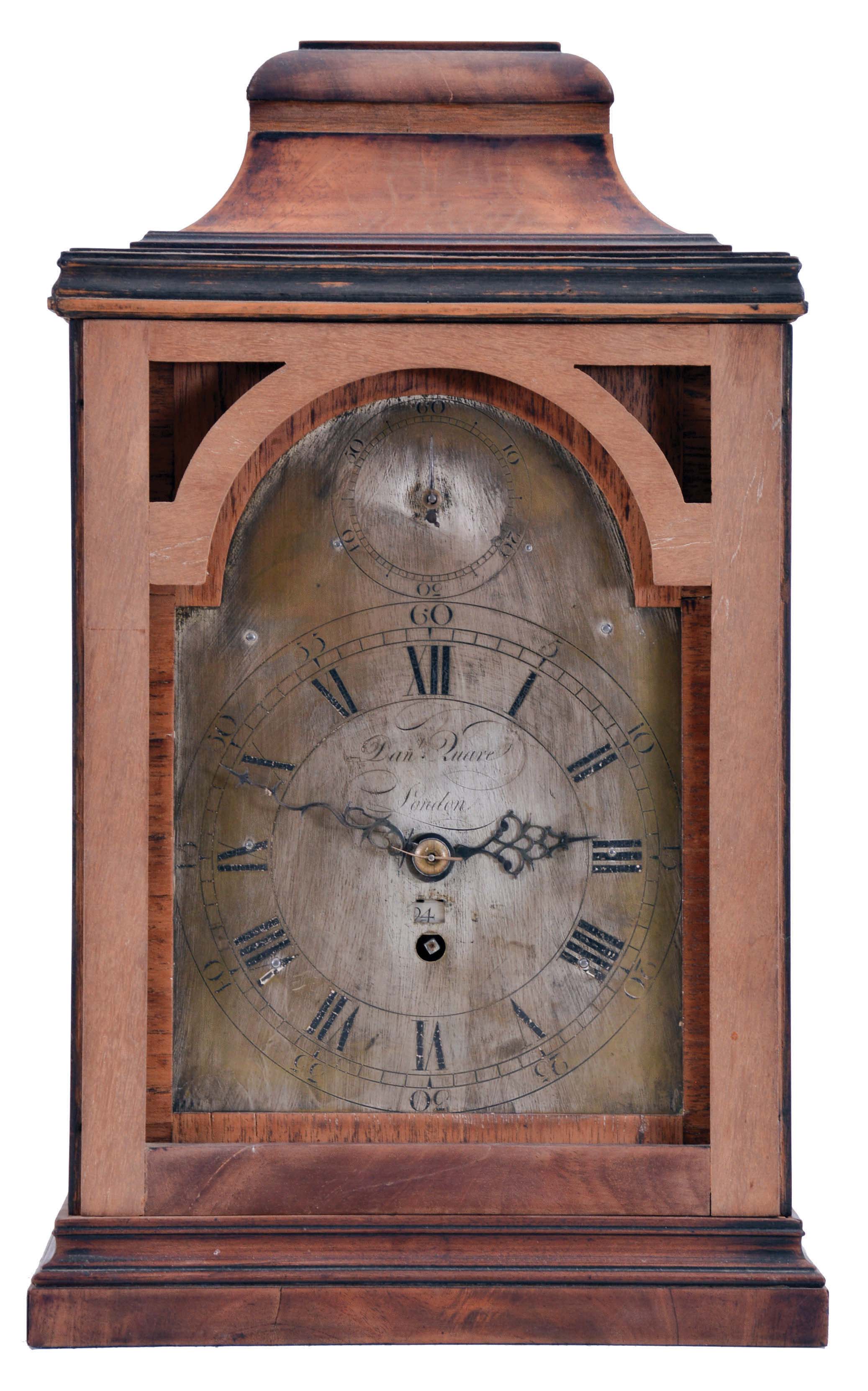 Daniel Quare, London, movement in later, purpose made bracket clock case, oak with mahogany veneers and brass furniture with later Roman numeral silvered sheet brass dial with date aperture and regulation control in the arch, blued steel hands, 8 day, five pillar fusee movement with verge escapement and pull quarter repeat, with beautifully engraved back plate bearing Quare's name. — Antique Clocks Price Guide