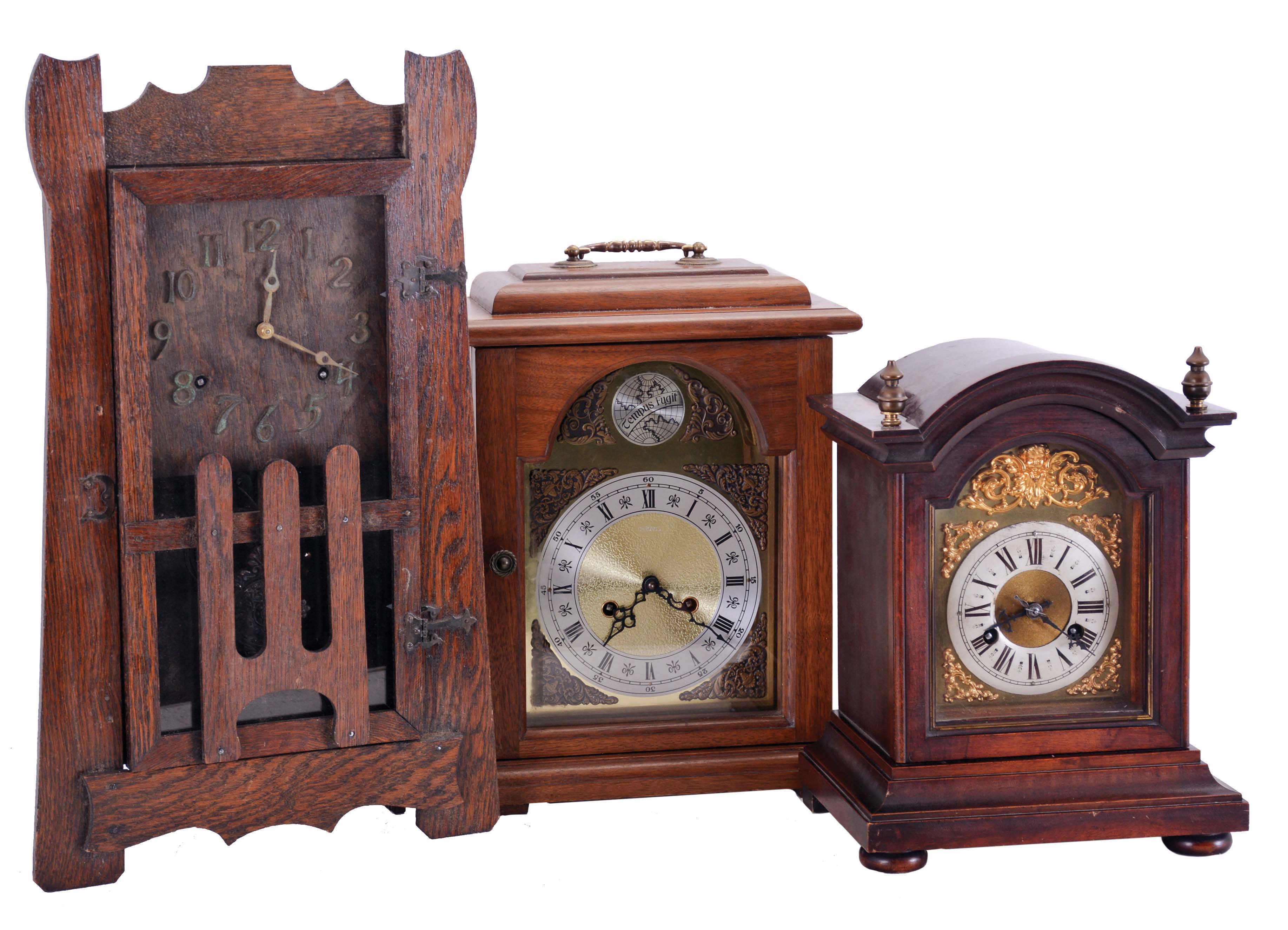 Clocks- 3 (Three) Mantel: (1) American, Mission oak shelf clock, 8 day time and strike, c1910; (2) Junghans, Germany, 8-day time & quarter strike bracket clock in a mahogany case, c1915; (3) German, modern bracket clock with floating balance movement in a walnut case, 1976. — Antique Clocks Price Guide