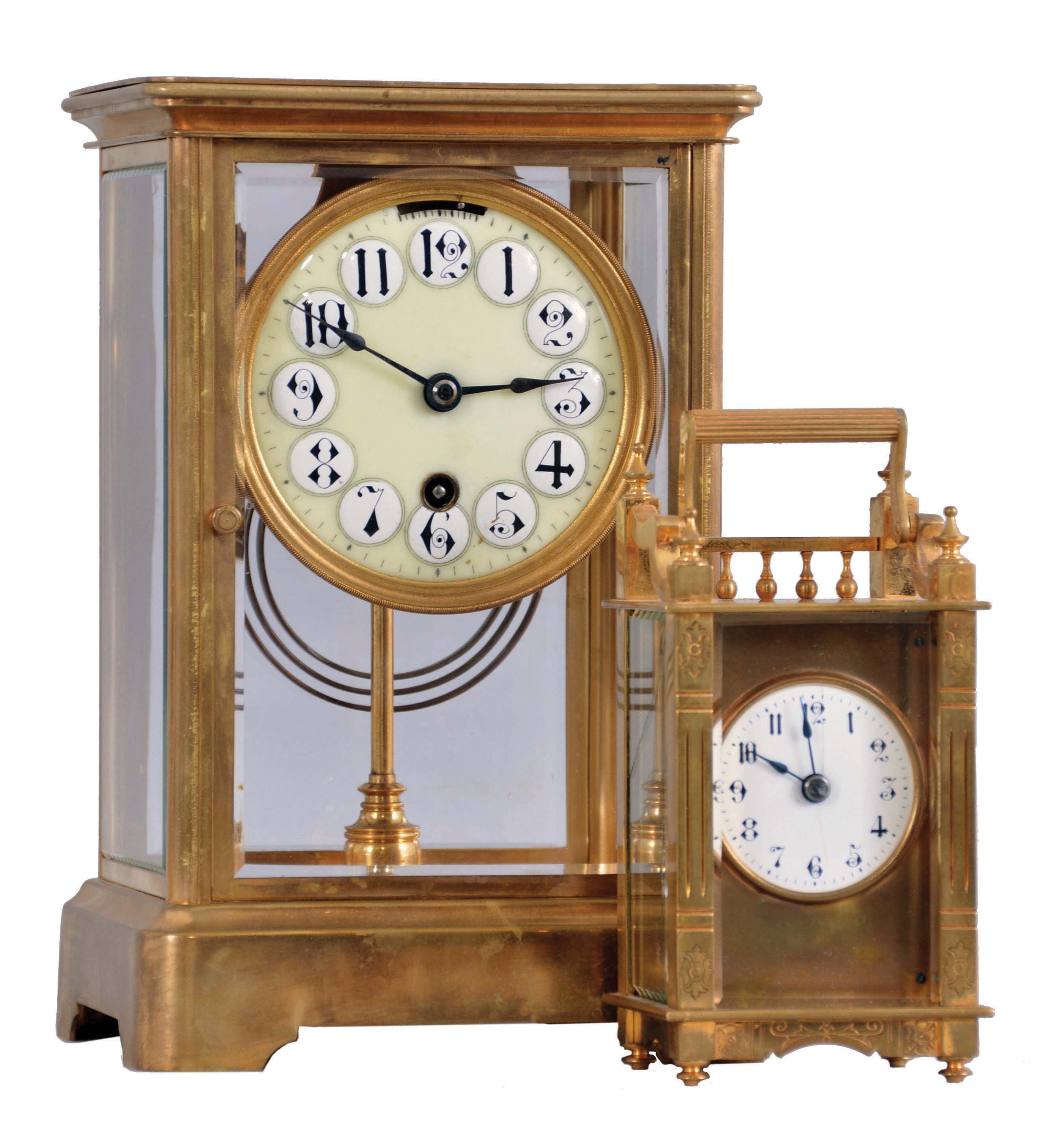 Clocks- 2 (Two) Boston Clock Co.: (1) Boston Clock Co., Chelsea, Mass., "Crystal", 8 day tandem wind, time and strike movement with lever escapement, in a brass case with enamel dial showing Arabic numerals, c1890; (2) Boston Clock Co., Chelsea, Mass., "Queen Anne" carriage clock, 8 day timepiece with platform escapement in a gilt brass case, with three beveled glasses and white enamel dial showing Arabic numerals, c1890. — Antique Clocks Price Guide