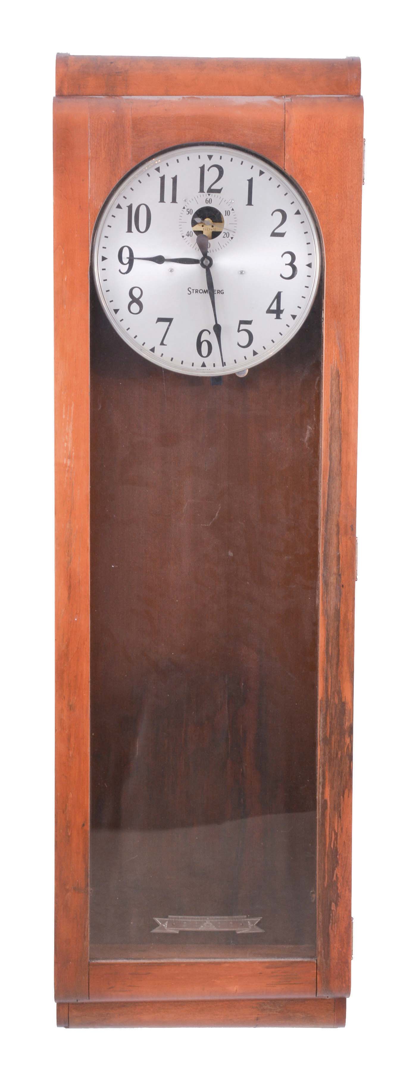 Stromberg Time Corporation, New York, NY, electric master regulator wall clock, time only movement marked "6957M" with deadbeat escapement in a mahogany case with silvered metal dial, patent date 1941 — Antique Clocks Price Guide