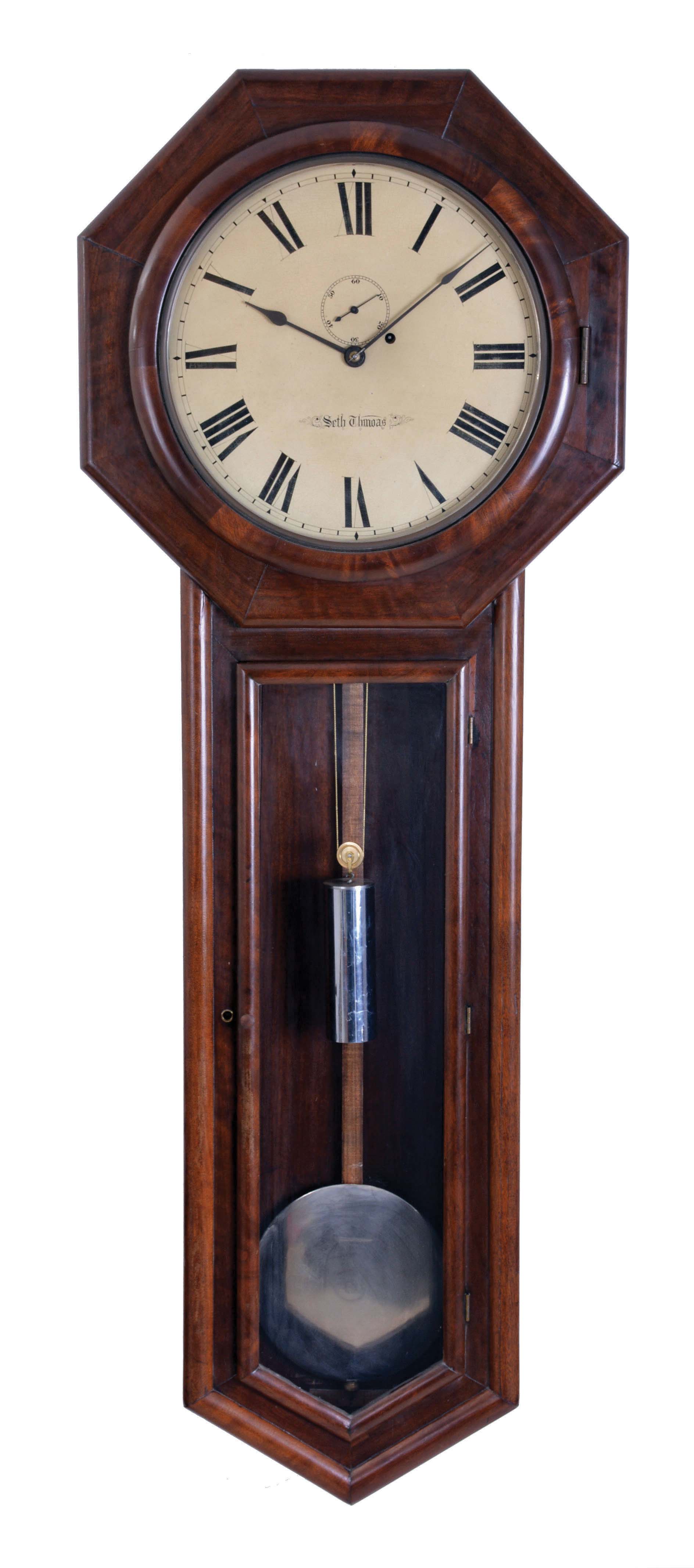 Seth Thomas Clock Co., Thomaston, Conn., "Regulator No. 18" wall clock with a weight driven 8 day timepiece movement in a walnut case. — Antique Clocks Price Guide