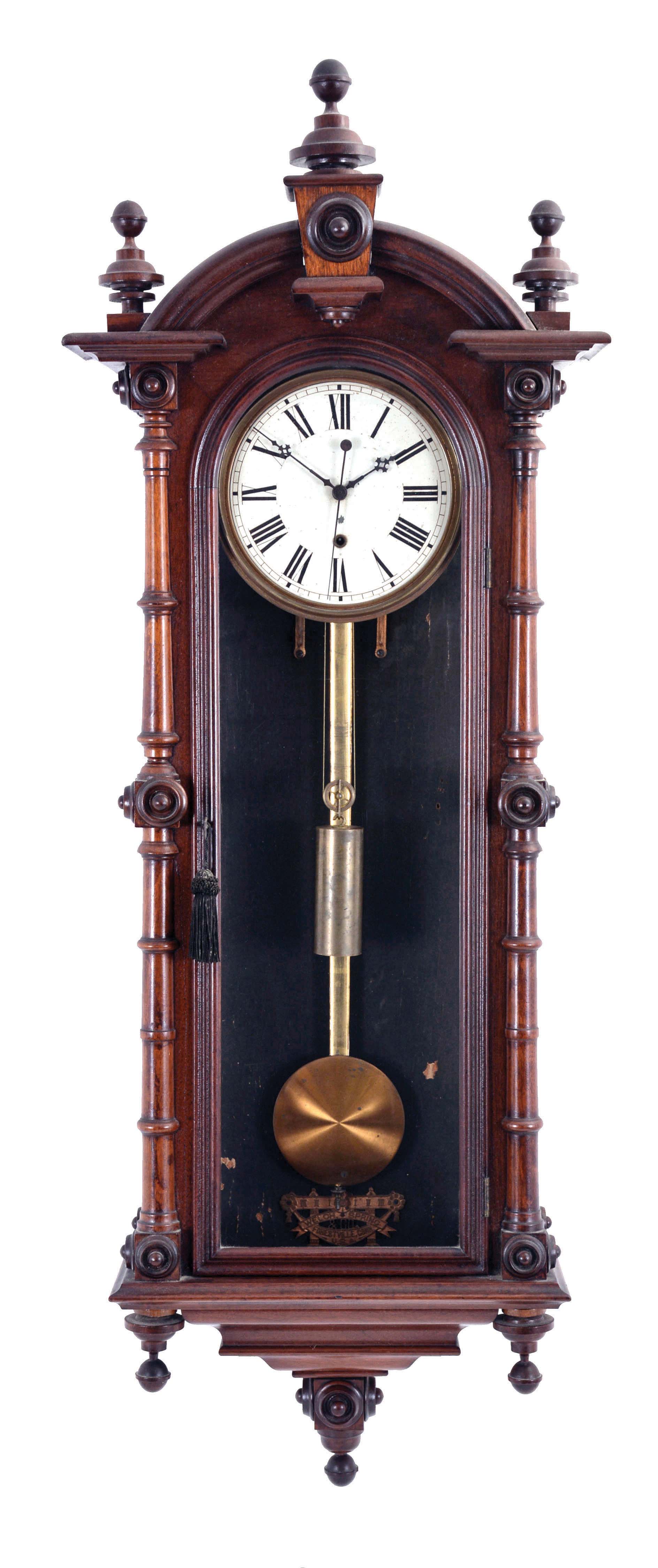 Welch, Spring & Co., Forestville, Conn., "Regulator No. 7" or often called the wall "Patti", walnut case with a profusion of turned ornament and flocked paper interior, Roman numeral painted dial, blued steel hands, 8 day, weight driven brass timepiece with sweep seconds, pendulum with gilt rod — Antique Clocks Price Guide