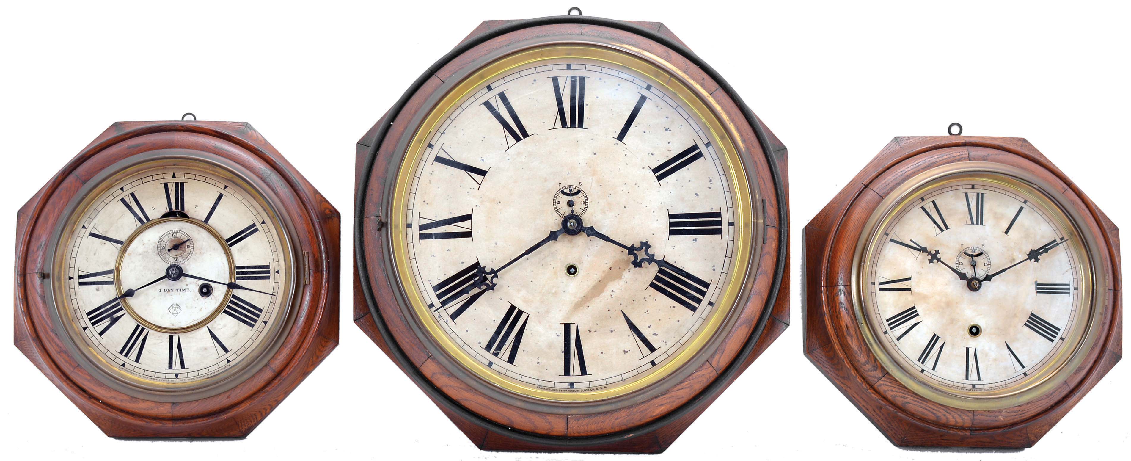 Clocks- 3 (Three): (1) Ansonia Clock Co., New York, NY, "8 Inch Octagon Lever" wall clock with a spring driven 30 hour lever timepiece movement in an oak case, c1880; (2) Waterbury Clock Co., Waterbury, Conn., "12 Inch Oak Lever" wall clock with a spring driven, 8 day lever timepiece movement in an oak case, c1914; (3) Waterbury Clock Co., Waterbury, Conn., "8 Inch Oak Lever" wall clock with a spring driven, 8 day lever timepiece movement in an oak case, c1906. — Antique Clocks Price Guide