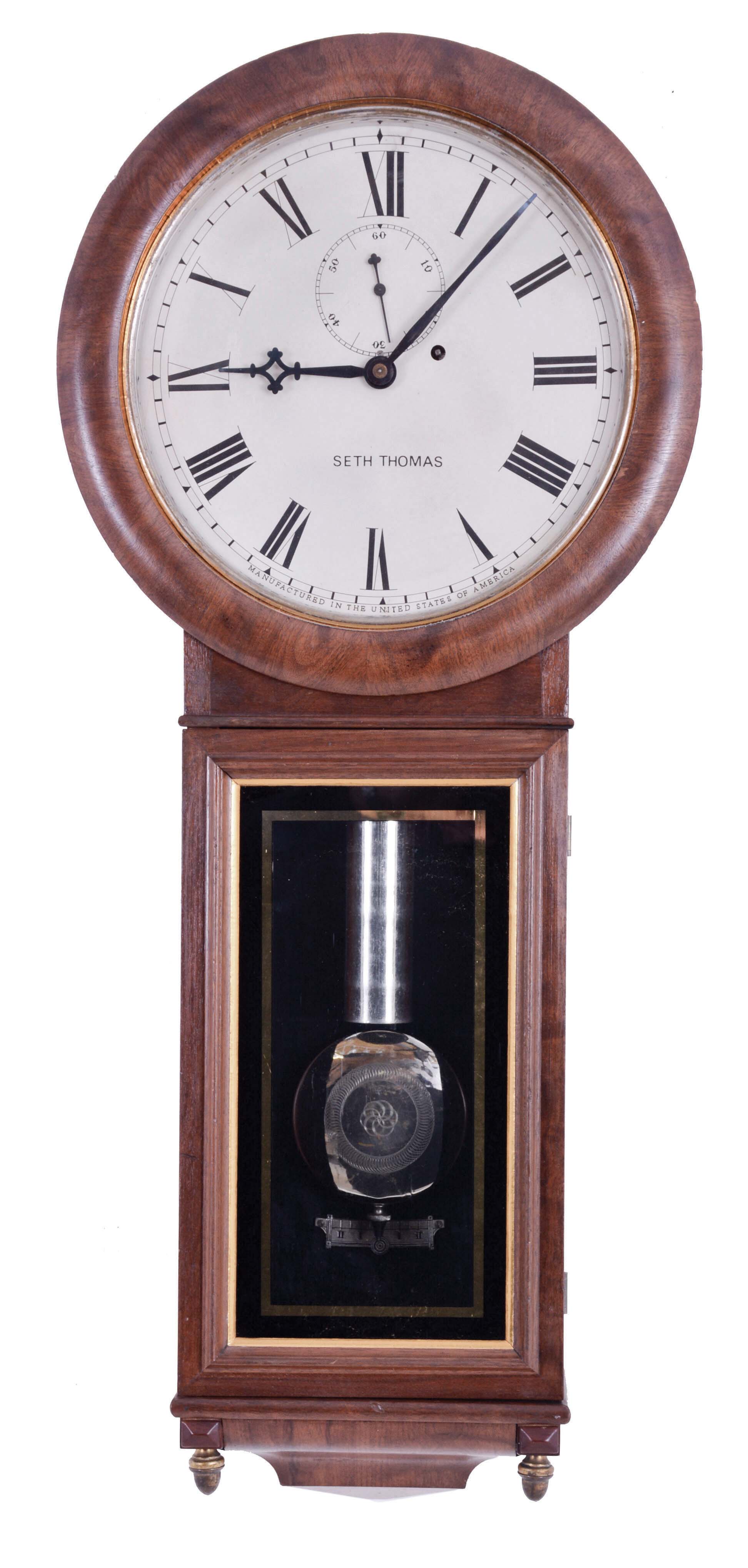 Seth Thomas Clock Co., Thomaston, Conn., "Regulator No. 1", wall clock, 8 day, time only, nickel plated brass weight driven movement in a walnut case with a painted metal dial, nickel plated weight, nickel plated pendulum bob with damascened pattern and reverse painted lower tablet, date stamped 1884 — Antique Clocks Price Guide