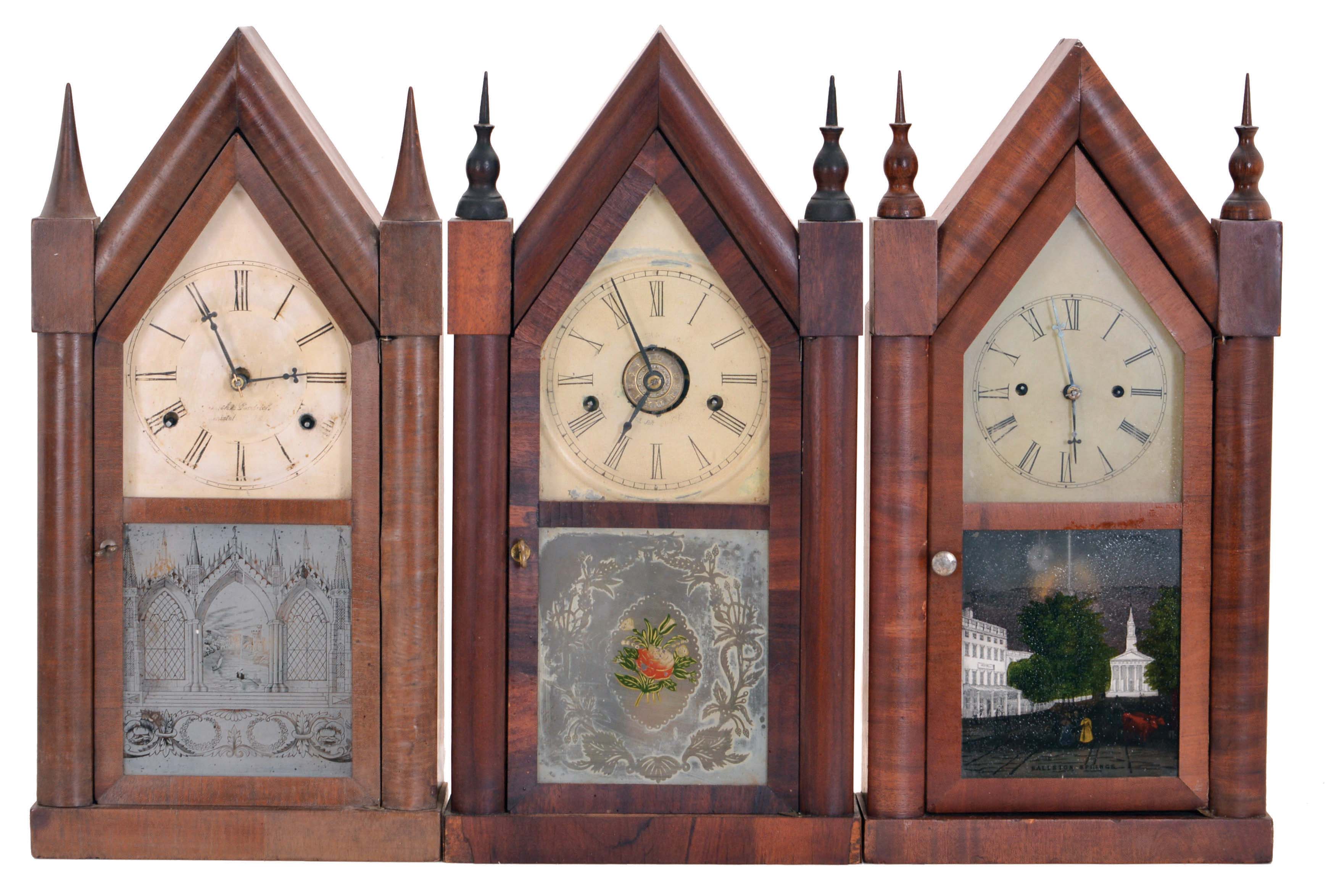 Clocks- 3 (Three): (1) Smith & Goodrich, Bristol, Conn., 30 hour, time and strike spring driven, fusee movement sharp gothic or steeple clock, c1850; (2) Chauncey Boardman, Bristol, Conn., 30 hour, time, strike and alarm spring driven movement sharp gothic or steeple clock, c1850; (3) Elisha Manross, Bristol, Conn., 30 hour, time and strike spring driven movement sharp gothic or steeple clock, c1850. — Antique Clocks Price Guide