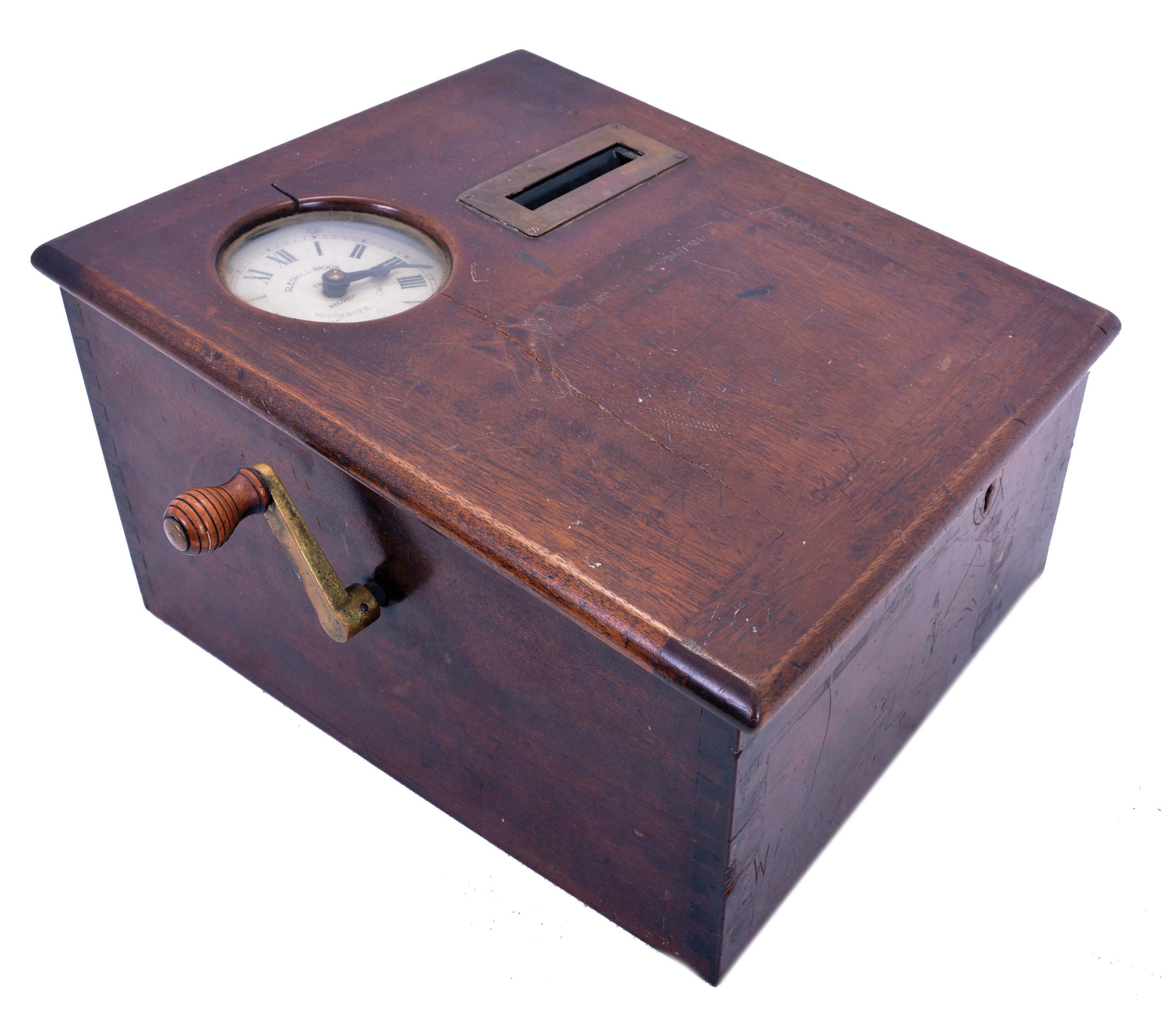 Clocks- 2 (Two) Time Recorders: (1) English 8 day spring driven movement punch clock with jeweled lever escapement movement stamped "9887", dial signed "Gledhill-Brook Time Recorder, Huddersfield, Eng." in a walnut case, c1900; (2) Belgian pigeon timer by Plasschaert Freres, No. 3714, c1905. — Antique Clocks Price Guide