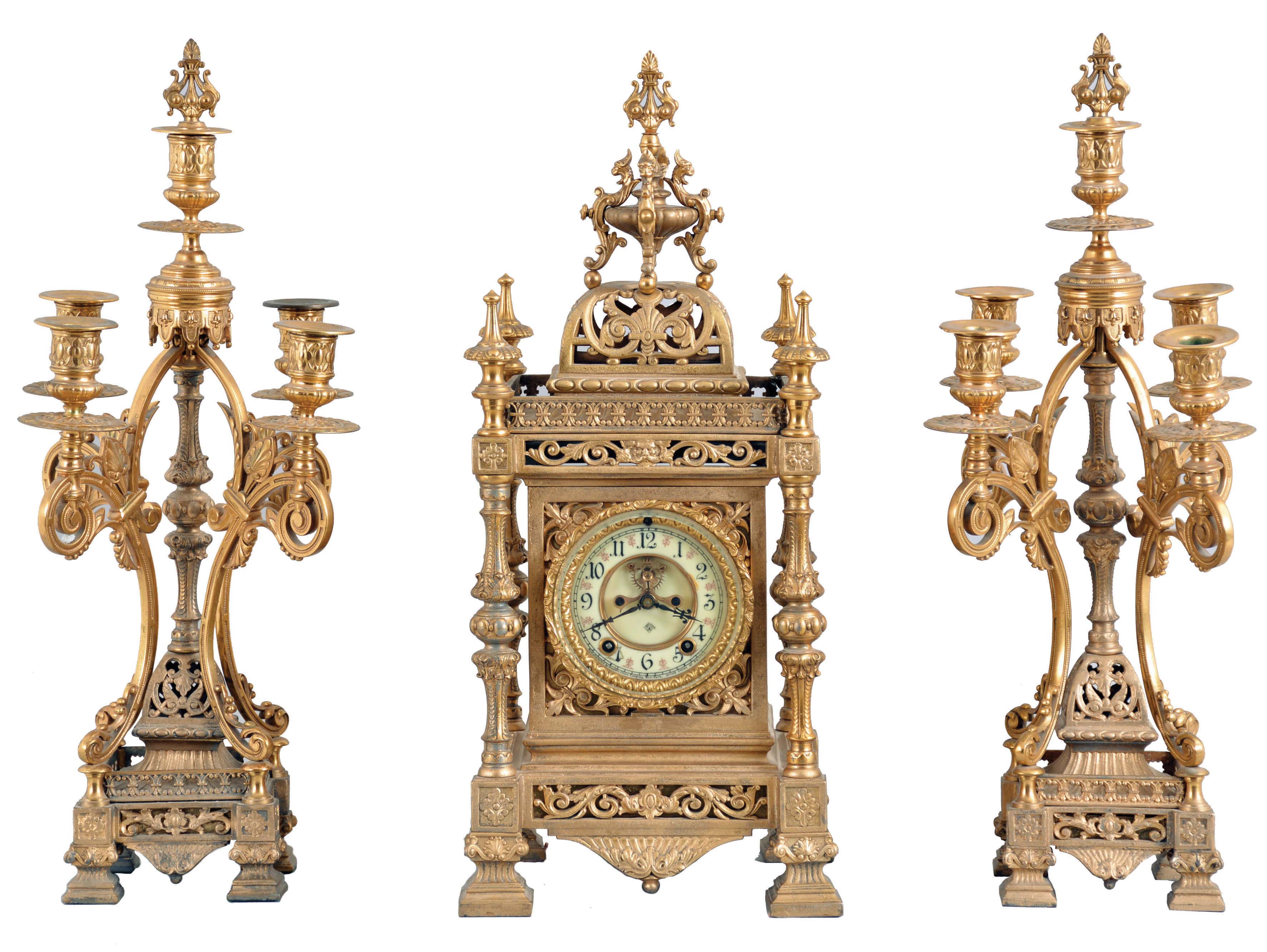 Ansonia Clock Co., New York, NY, "The Regent" mantel clock with matching candelabra, fancy cast case with gilt finish, Arabic numeral white enamel dial, 8 day, time and strike movement — Antique Clocks Price Guide