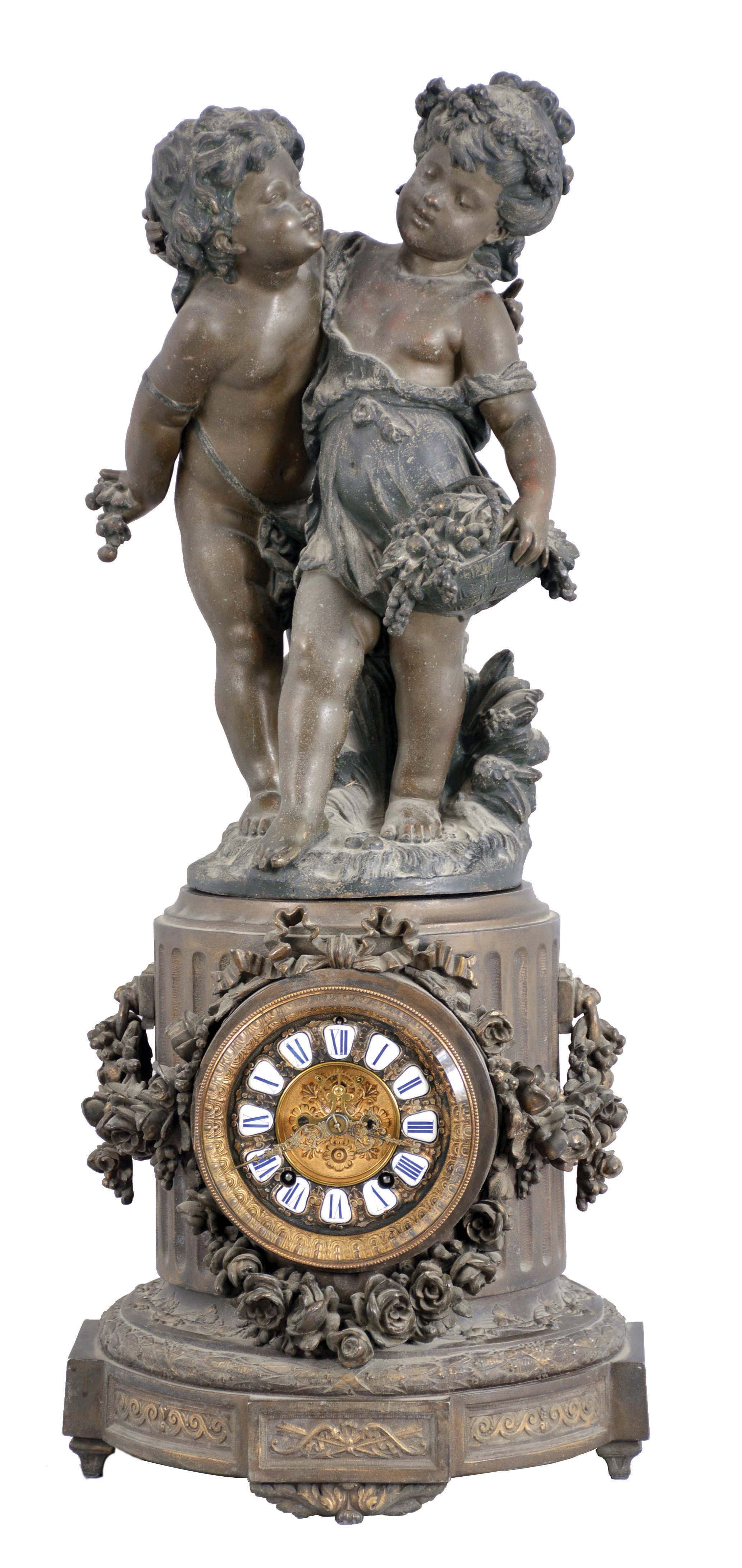 Ansonia Clock Co., New York, NY, "Florida"  base with 1089 group (Cherubs) figural shelf clock with a spring driven, 8 day, time and rack & snail strike movement with visible escapement in a cast metal case with a Barbedienne finish. — Antique Clocks Price Guide