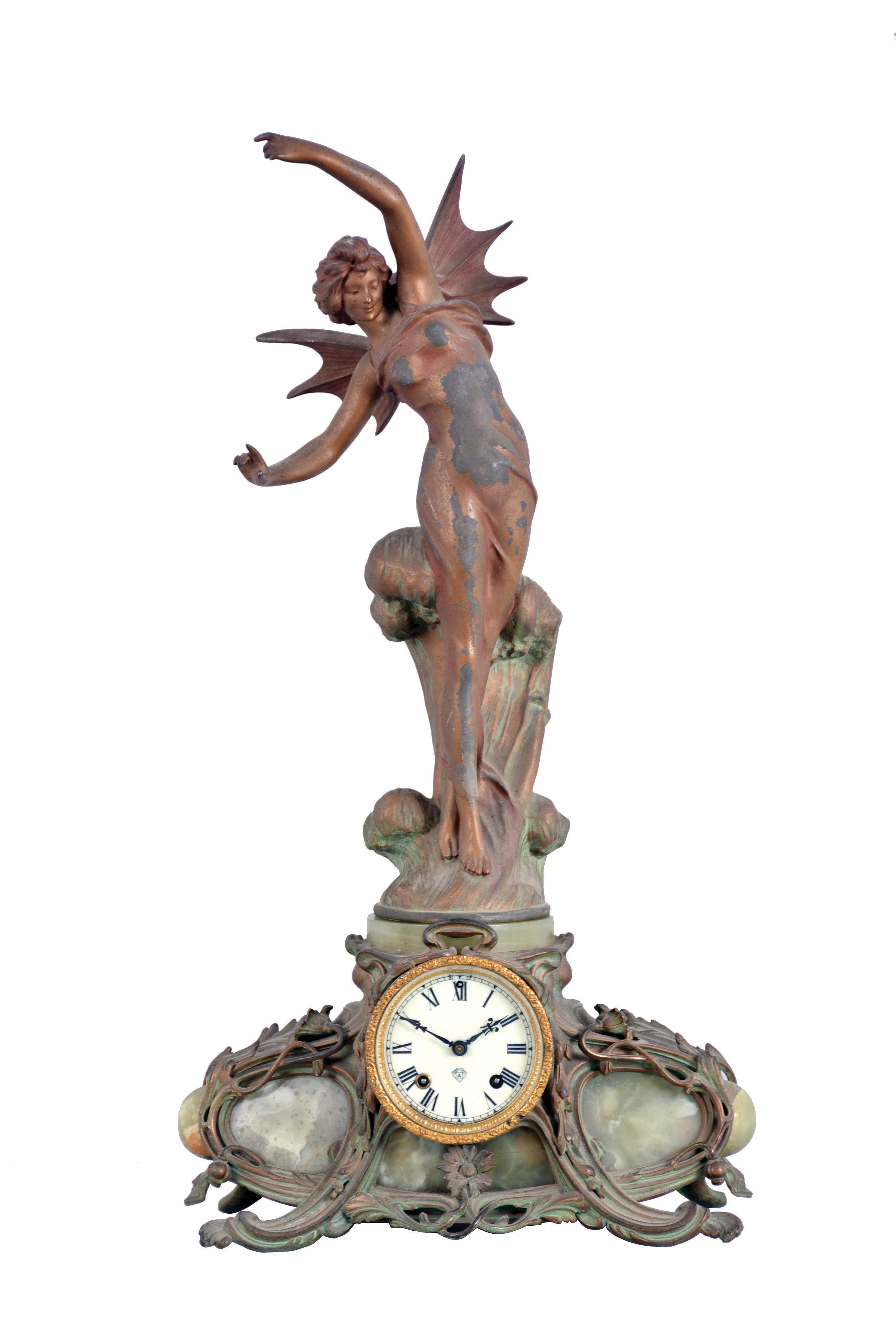 Ansonia Clock Co., New York, NY, "Superba base with La Vague top ornament" figural shelf clock with a spring driven, 8 day, time and strike movement in a cast metal case with Brazilian onyx panel inserts. — Antique Clocks Price Guide