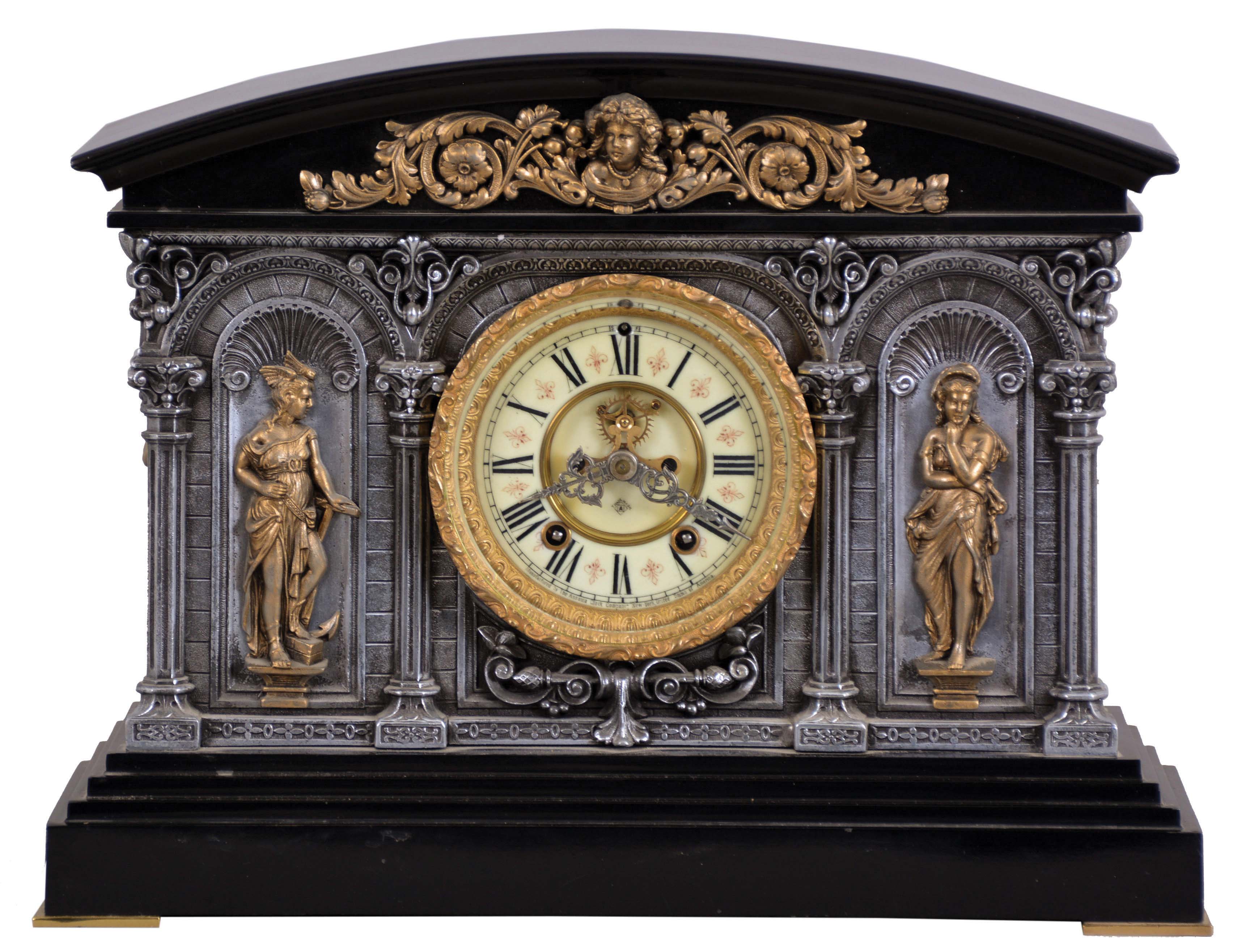 Ansonia Clock Co., New York, NY, "Georgia" mantel clock with a spring driven, 8 day, time and rack & snail strike movement with visible escapement in a cast metal and enameled iron case. — Antique Clocks Price Guide