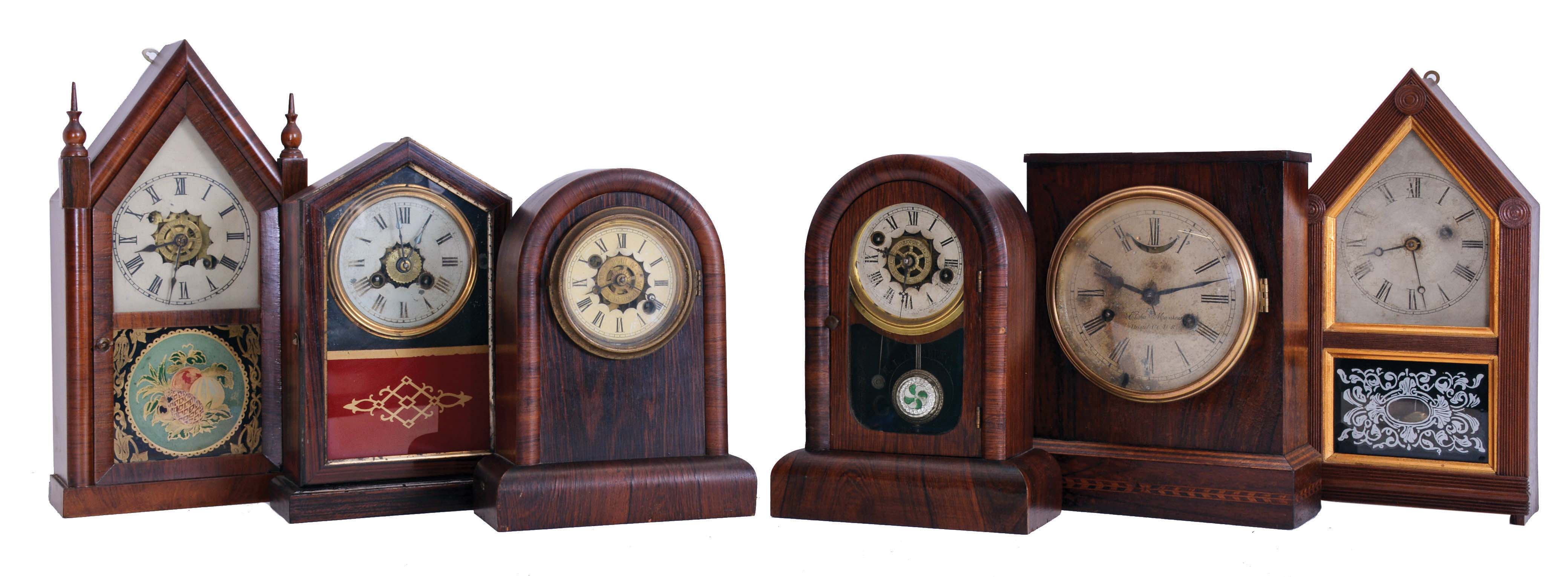 Clocks- 6 (Six): (1) Jerome & Co., New Haven, Conn., 30 hour, time and alarm spring driven movement miniature steeple clock, c1865; (2) Atkins Clock Co., Bristol, Conn., 30 hour, spring driven movement steeple form cottage timepiece, c1865; (3) William L. Gilbert Clock Co., Winsted, Conn., 30 hour time and alarm spring driven movement cottage timepiece, c1870; (4) William L. Gilbert Clock Co., Winsted, Conn., 30 hour, time and alarm cottage timepiece, c1870; (5) Elisha Manross, Bristol, Conn., 30 hour, time and strike spring driven, lever movement cottage clock, c1850; (6) Union Clock Co., 30 hour, time and strike spring driven movement cottage clock, c1870. Also included are two modern made clock shelves. — Antique Clocks Price Guide