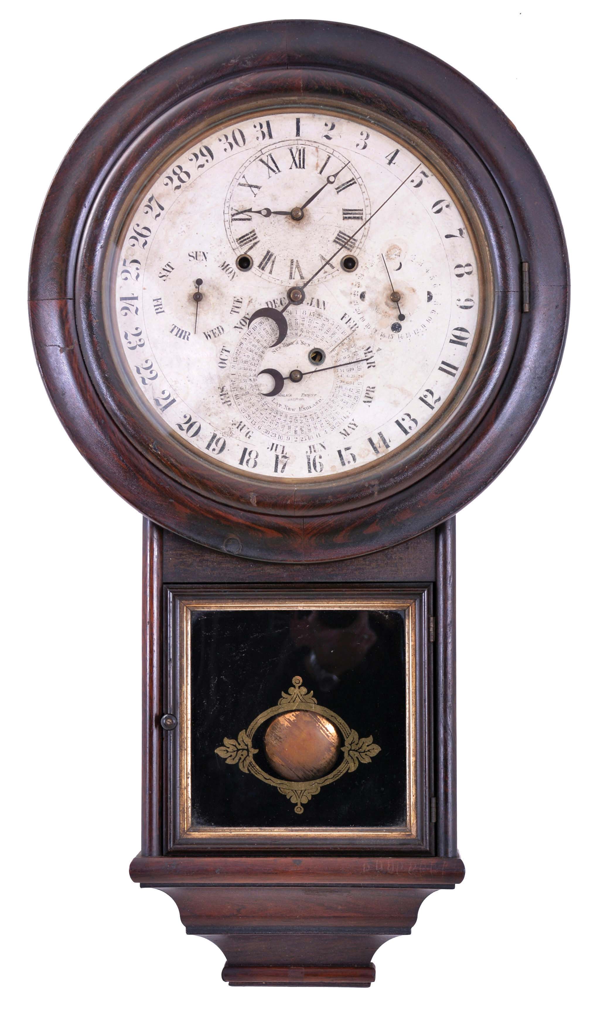 Welch, Spring & Co., Forestville, Conn., "Gale Drop Calendar Model No. 2" wall clock, case grained to simulate rosewood, turned wooden bezel, door with reverse painted tablet, and complex molded base, paper dial on metal pan, 8 day, time and strike, spring driven brass movement with Daniel J. Gale's patent perpetual calendar — Antique Clocks Price Guide