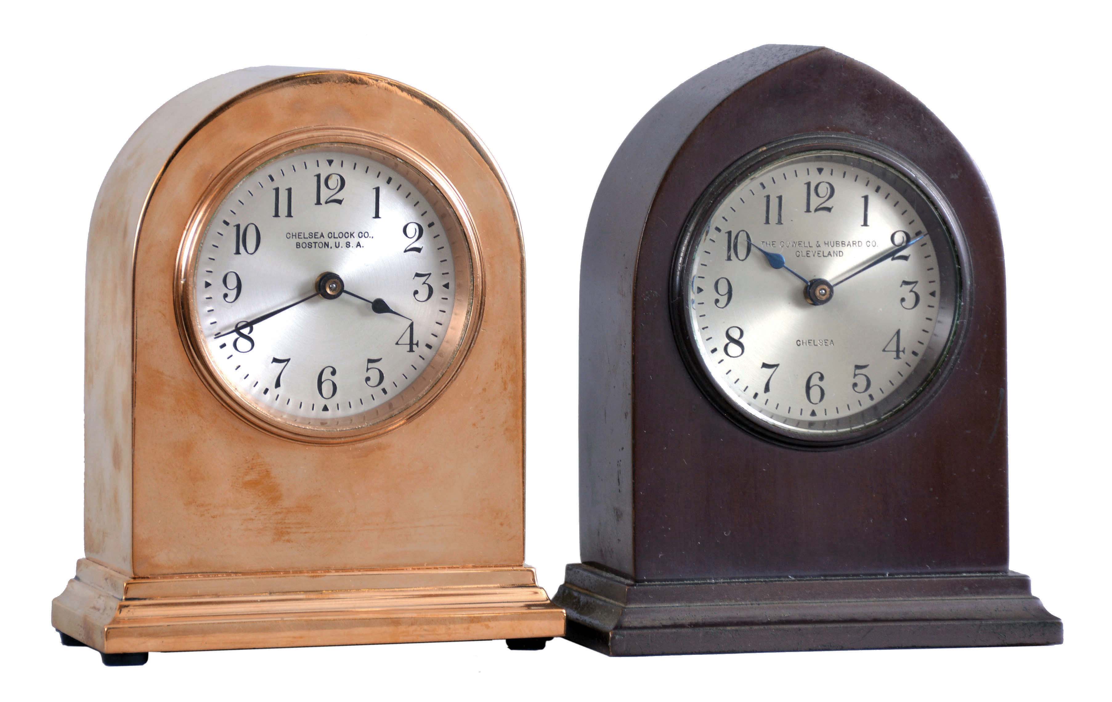 Clocks- 2 (Two) Chelsea: (1) Chelsea Clock Co., Boston, Mass., for The Cowell & Hubbard Co., Cleveland, "Doric", 8 day, timepiece with 2.5 inch silvered dial in a polished red brass case, serial number 160482, c1924.; (2) Chelsea Clock Co., Boston, Mass., "Gothic", 8 day, timepiece with 2.5 inch silvered dial in a brass case with bronze finish, serial number 160078, c1924. — Antique Clocks Price Guide