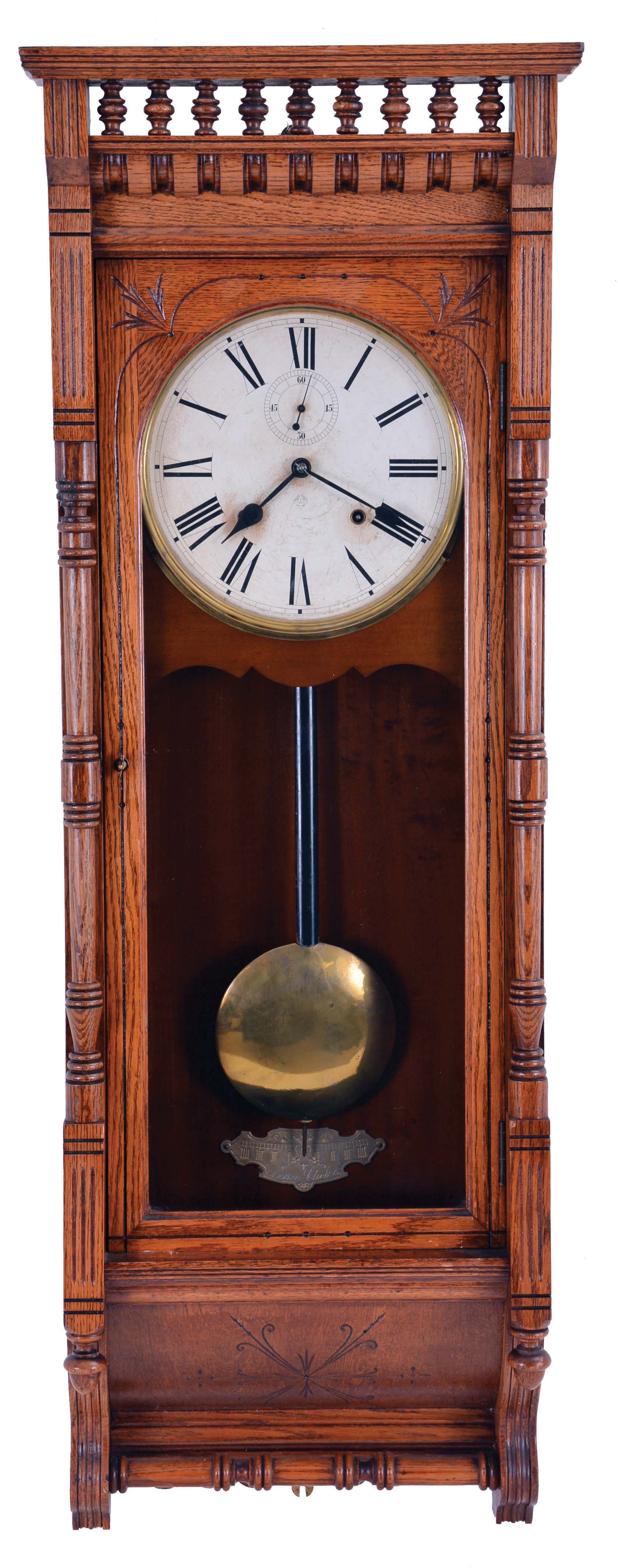 Ansonia Clock Co., New York, NY, "Santa Fe" hanging clock with a spring driven, 8 day time and half hour strike (cathedral gong) in an oak case. — Antique Clocks Price Guide