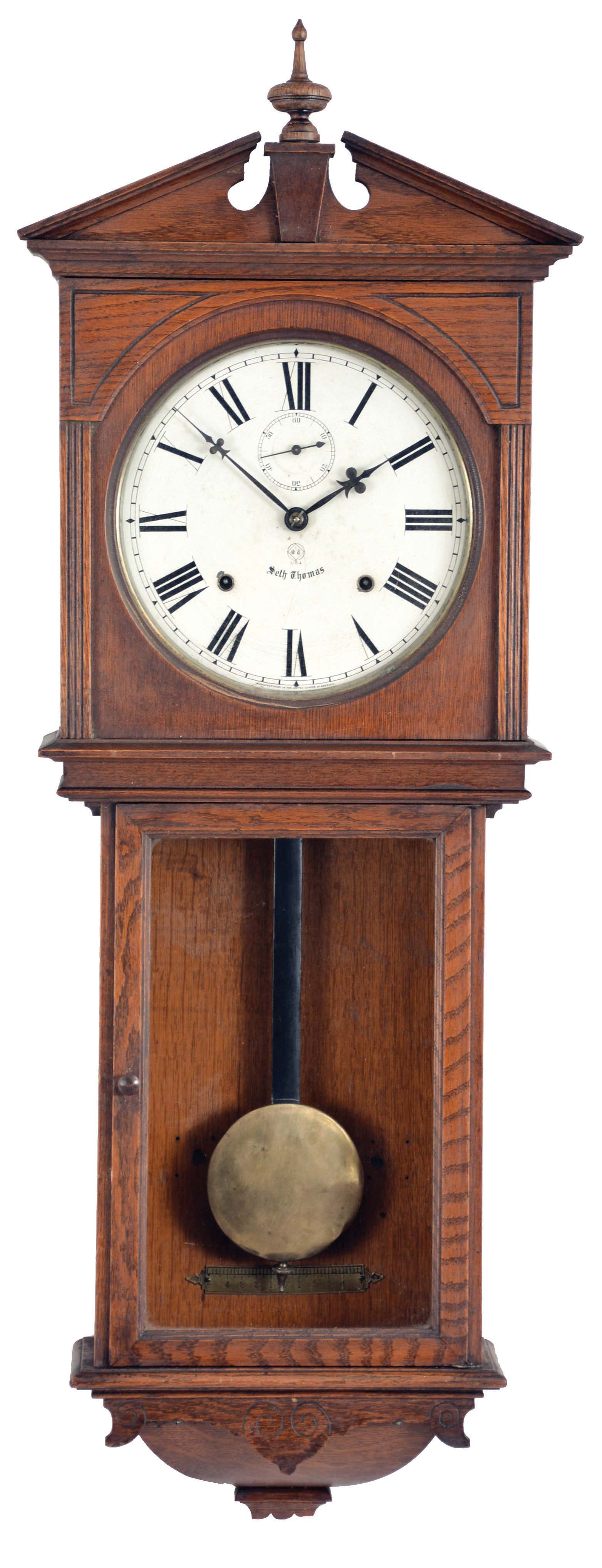 Seth Thomas Clock Co., Thomaston, Conn., "Umbria" hanging clock with a spring driven, 8 day, time and strike, (cathedral gong) movement in an oak case. — Antique Clocks Price Guide