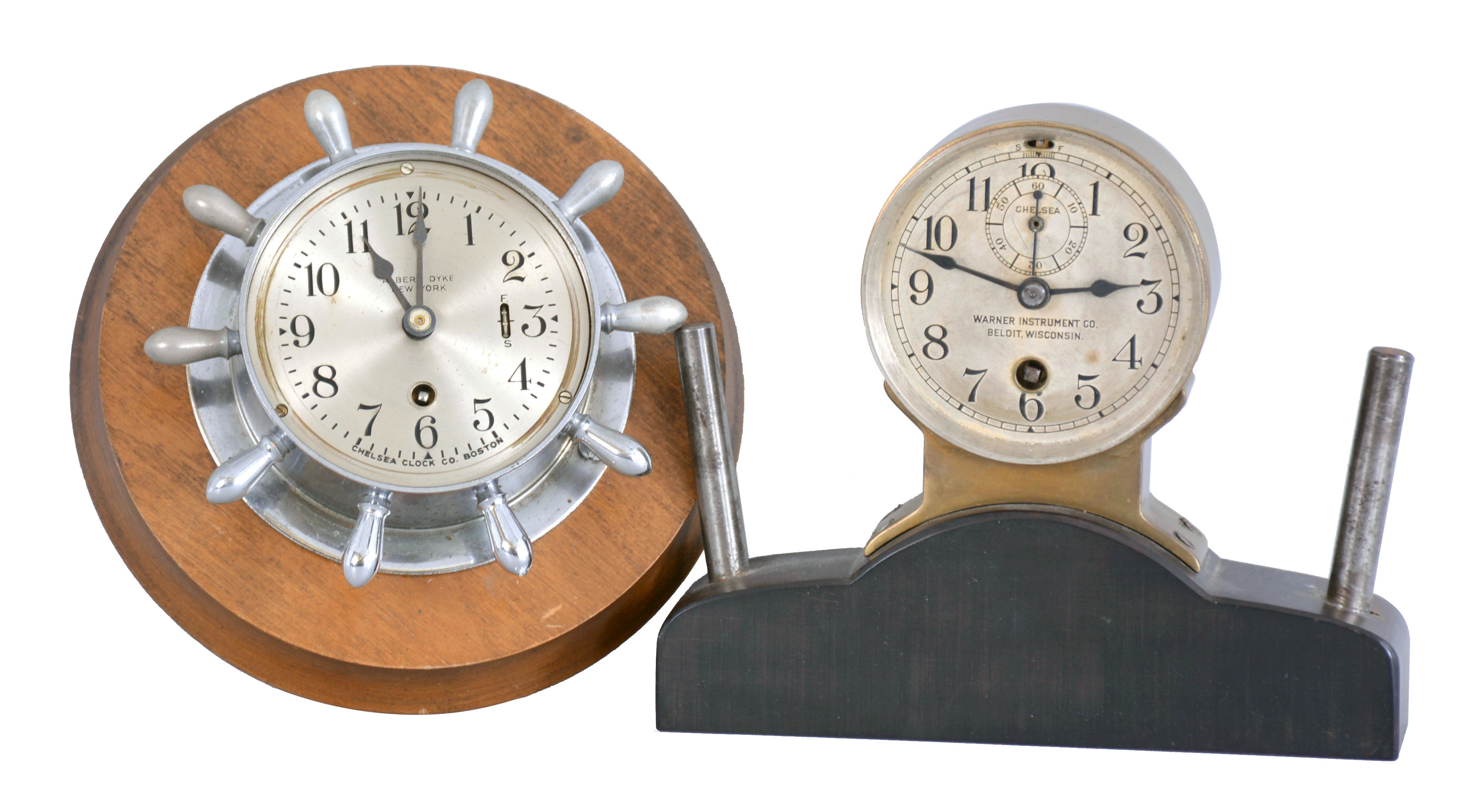 Clocks- 2 (Two) Chelsea: (1) Chelsea Clock Co., Boston, Mass., for Albert Dyke, New York, "Manhattan" instrument board clock, 8 day timepiece in a nickel case taking the form of a yacht wheel with 2.75 inch dial, serial number 573624, c1952. (2) Chelsea Clock Co., Boston, Mass., for Warner Instrument Co., Beloit, Wisconsin, 8 day, timepiece with a 2.75 inch dial, fitted to the top of a dark hardwood base inside of a brass case perhaps designed for an instrument panel or dashboard, serial number 38776, c1911. — Antique Clocks Price Guide