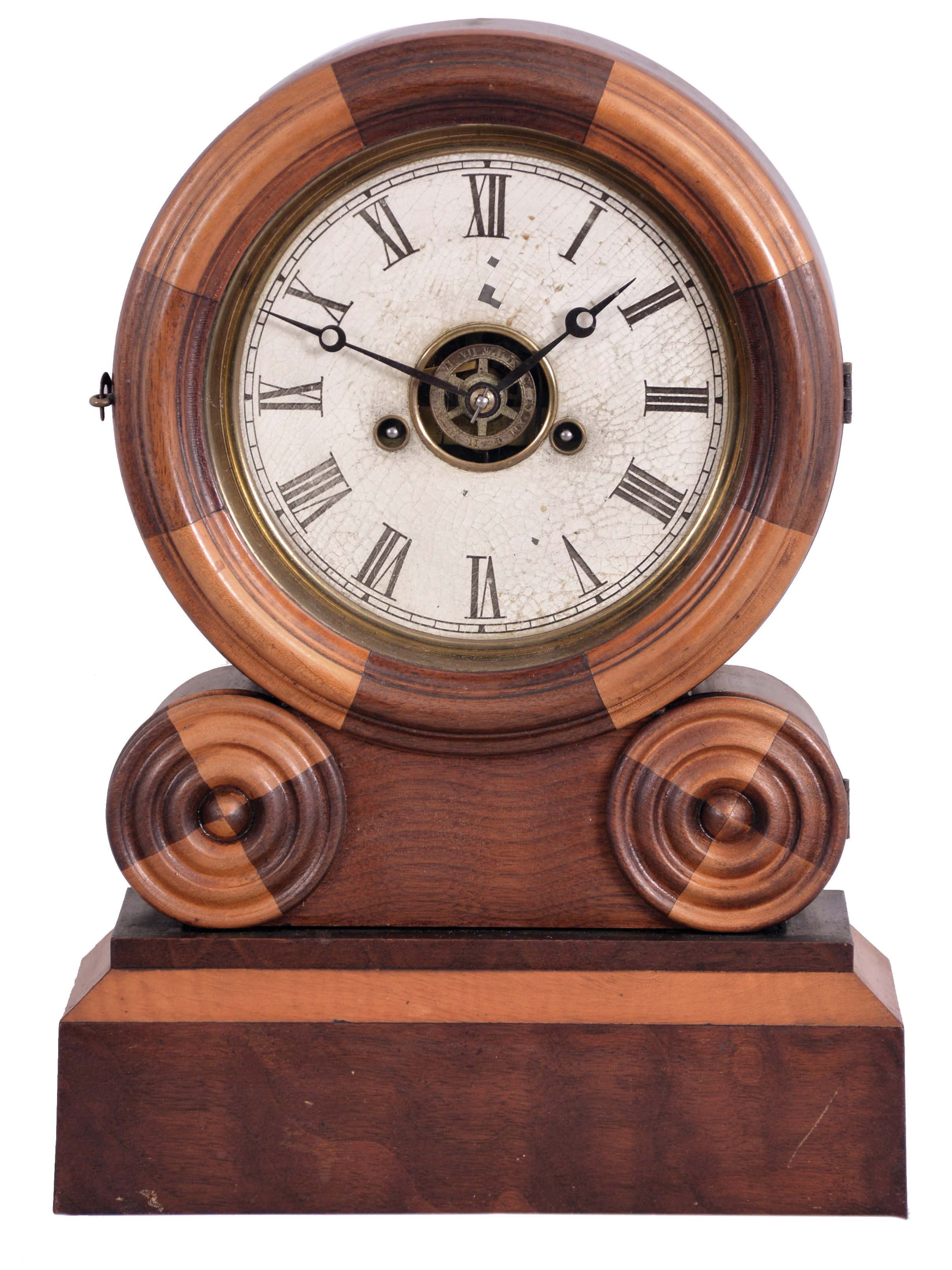E. Ingraham & Co., Bristol, Conn., "Grecian Mosaic" shelf clock with a spring driven 30 hour time, strike and alarm movement in a walnut and maple case. — Antique Clocks Price Guide