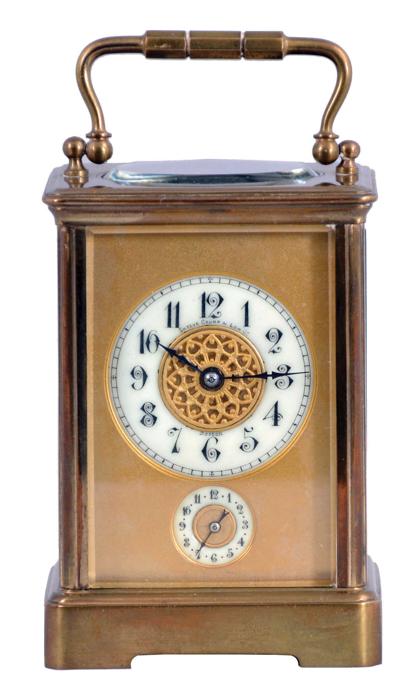 France, for Shreve, Crump & Low, Boston, striking carriage clock with alarm, brass Corniche case with beveled glasses, Arabic numeral white enamel dial with gilt mask, and subsidiary alarm chapter, blued steel distaff style hands, 8 day striking movement with lever platform, sounding the hour and half hour in passing — Antique Clocks Price Guide