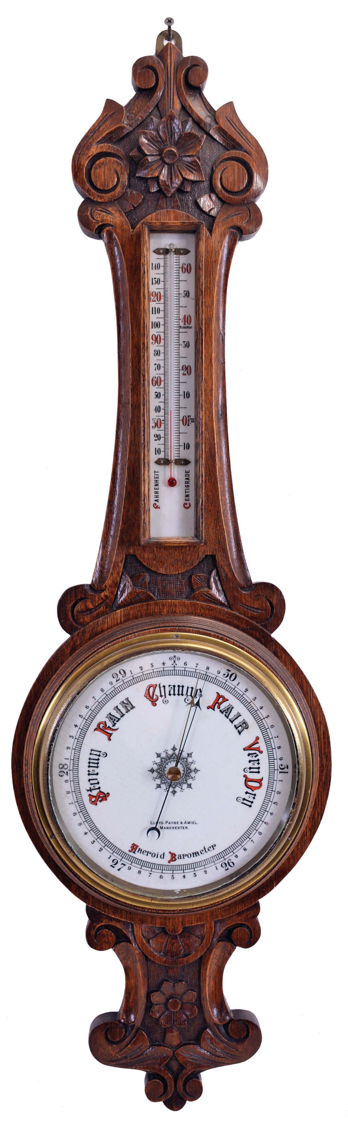 Barometers- 2 (Two) English: (1) Lloyd, Payne & Amiel, Manchester, aneroid barometer with alcohol thermometer with red accented scales in a carved oak case with floral design; (2) Chapman, Lewes, banjo or wheel mercury barometer with thermometer, hygrometer, and spirit level in a rosewood veneered case. — Antique Clocks Price Guide