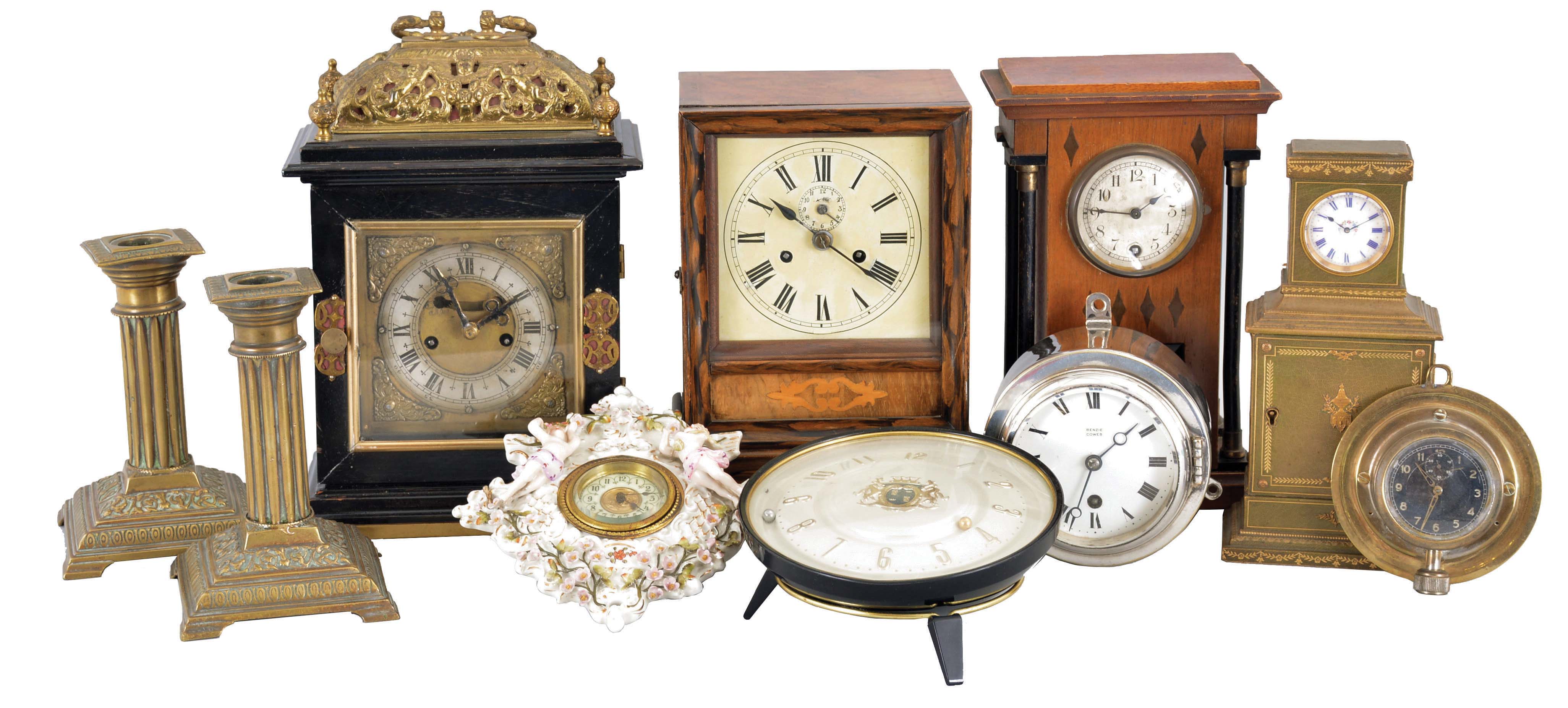 Clocks- 8 (Eight) Mantel & Desk: (1) Austria, bracket clock, 8 day, time and strike in a wood case with brass basket top and silvered chapter ring; (2) Winterhalder & Hofmeier, Germany, mantel clock, 30 hour, time and strike in a walnut case; (3) "Rapid Ralph" novelty clock; (4) Benzie Cowes, England, wall clock in nickel case; (5) Hanging clock, 30 hour, time only in ornate ceramic case; (6) Germany, car clock with a brass mounting plate; (7) Hamburg American Clock Co., Germany, 8 day, time only in wood case; (8) Watch-sized movement in miniature chest of drawers; (9) and (10) brass candlesticks. — Antique Clocks Price Guide