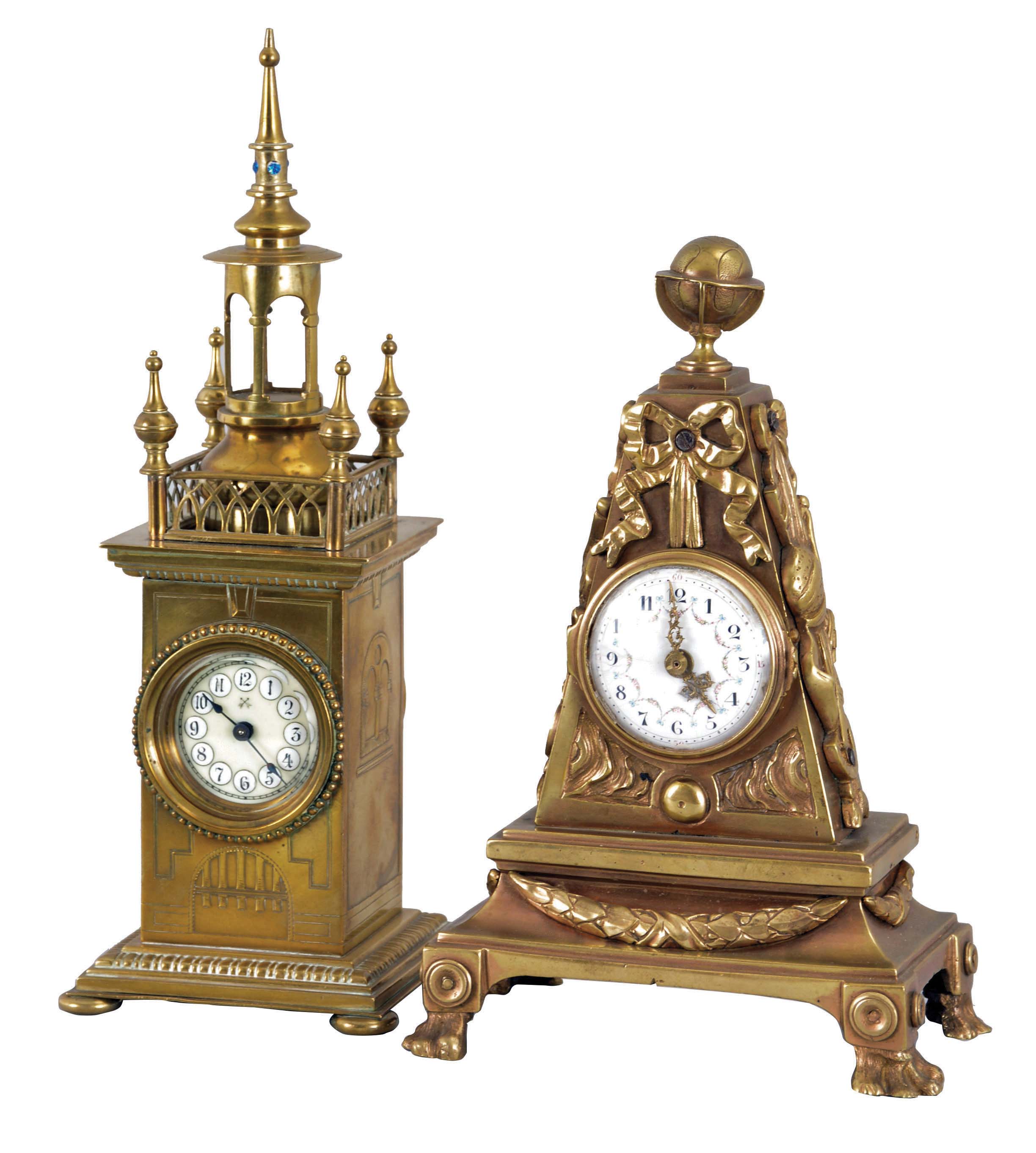 Clocks- 2 (Two) German and Swiss Mantel: (1) Hamburg American Clock Co., Germany, 30 hour time only lever movement in a brass architectural case with jeweled spire and cream colored porcelain dial. (2) Swiss, 30 hour, 17 jewel time only movement in a brass case with claw feet, bowknot suspended trophy ornaments topped with a globe, holding a white polychrome dial with Arabic numerals. — Antique Clocks Price Guide