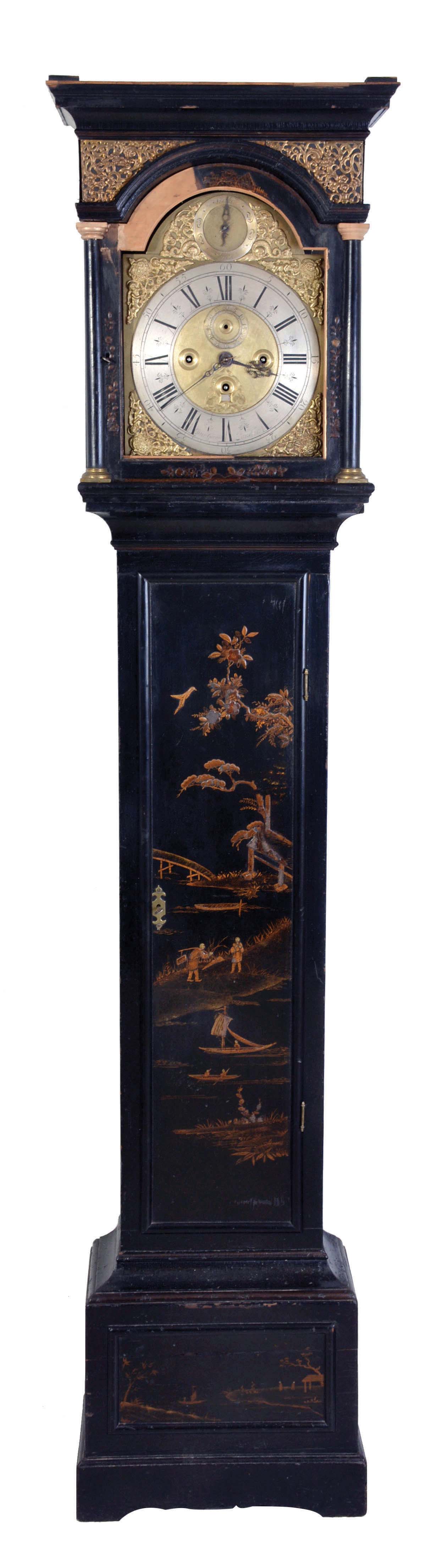 Peter Garon, London, three train chiming tall clock with chinoiserie case, the base with cavetto molding, trunk with rectangular door and brass strap hinges, bonnet with applied, cast brass fret in frieze, and door with integral, flanking columns, composite dial with gilt, matted center, decorated winding and seconds holes, gilt spandrels, and silvered, Roman numeral chapter ring, with strike/ silent selection in the arch, blued, pierced steel hands, and substantial, weight driven brass movement with five pillars, chiming on 6 bells, and striking the hours on a gong — Antique Clocks Price Guide