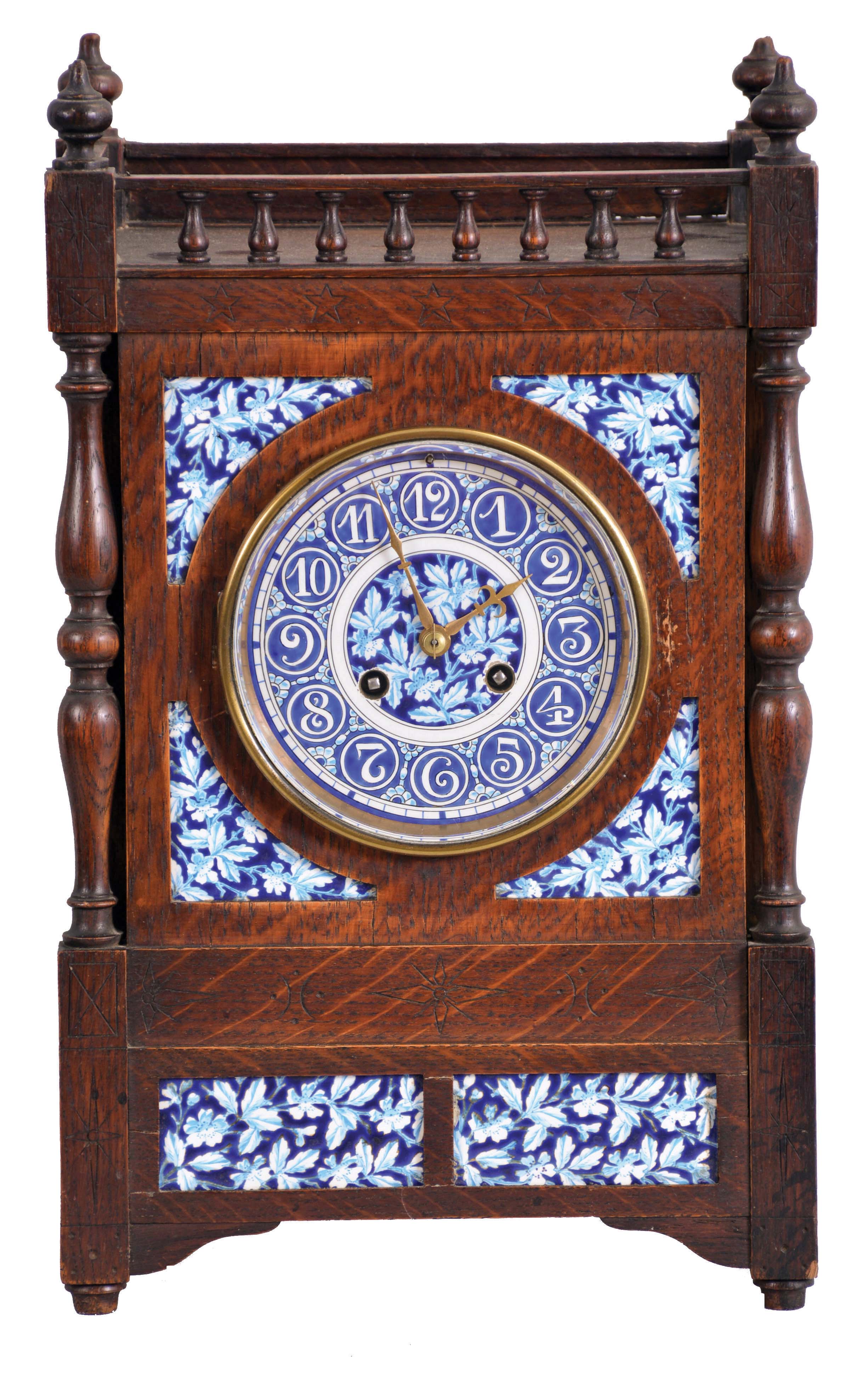 French, oak cased mantel clock with blue and white inserts and dial, 8 day, time and strike, with a movement stamped "C. J. & Co.", the case with turned corner columns and finials. — Antique Clocks Price Guide
