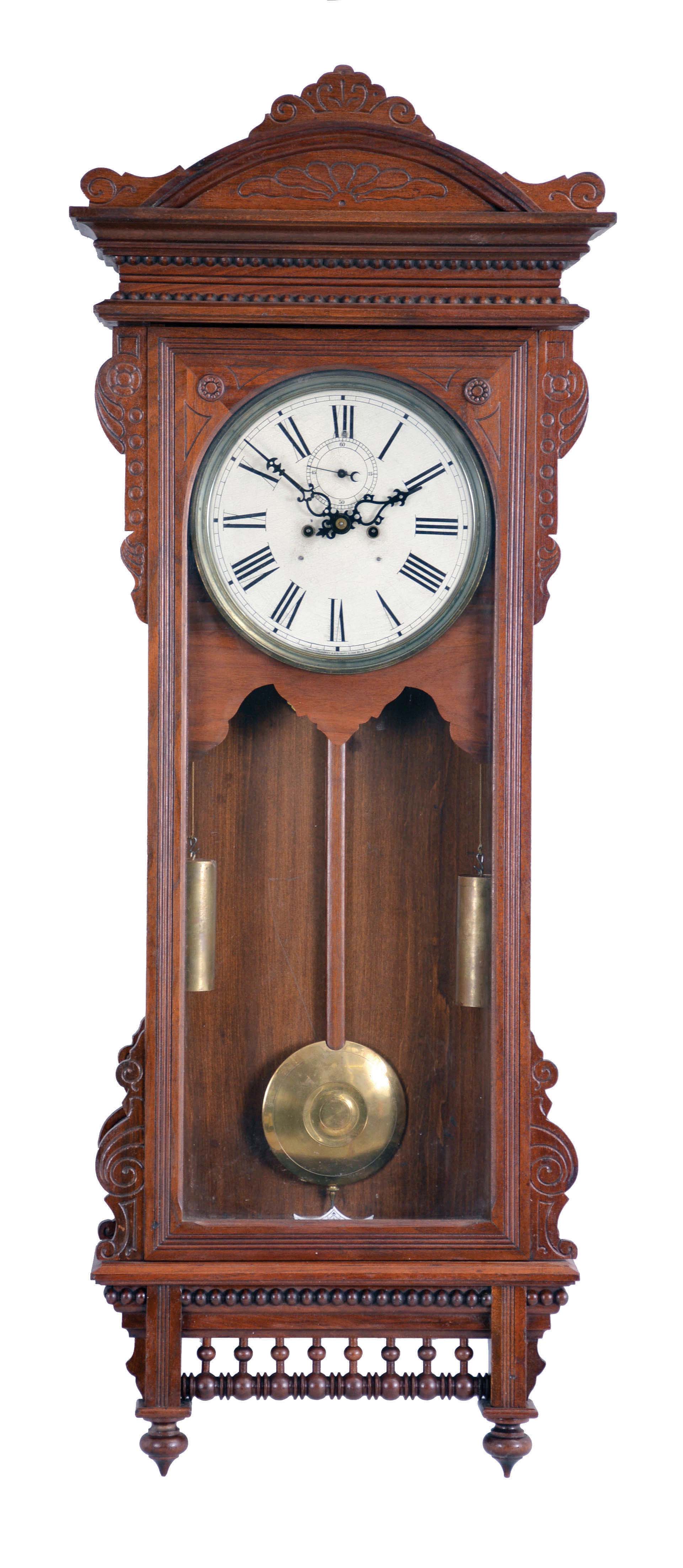 Waterbury Clock Co., Waterbury, Conn., "Regulator No. 57" hanging clock with a double weight driven 8 day timepiece movement in a mahogany case. — Antique Clocks Price Guide