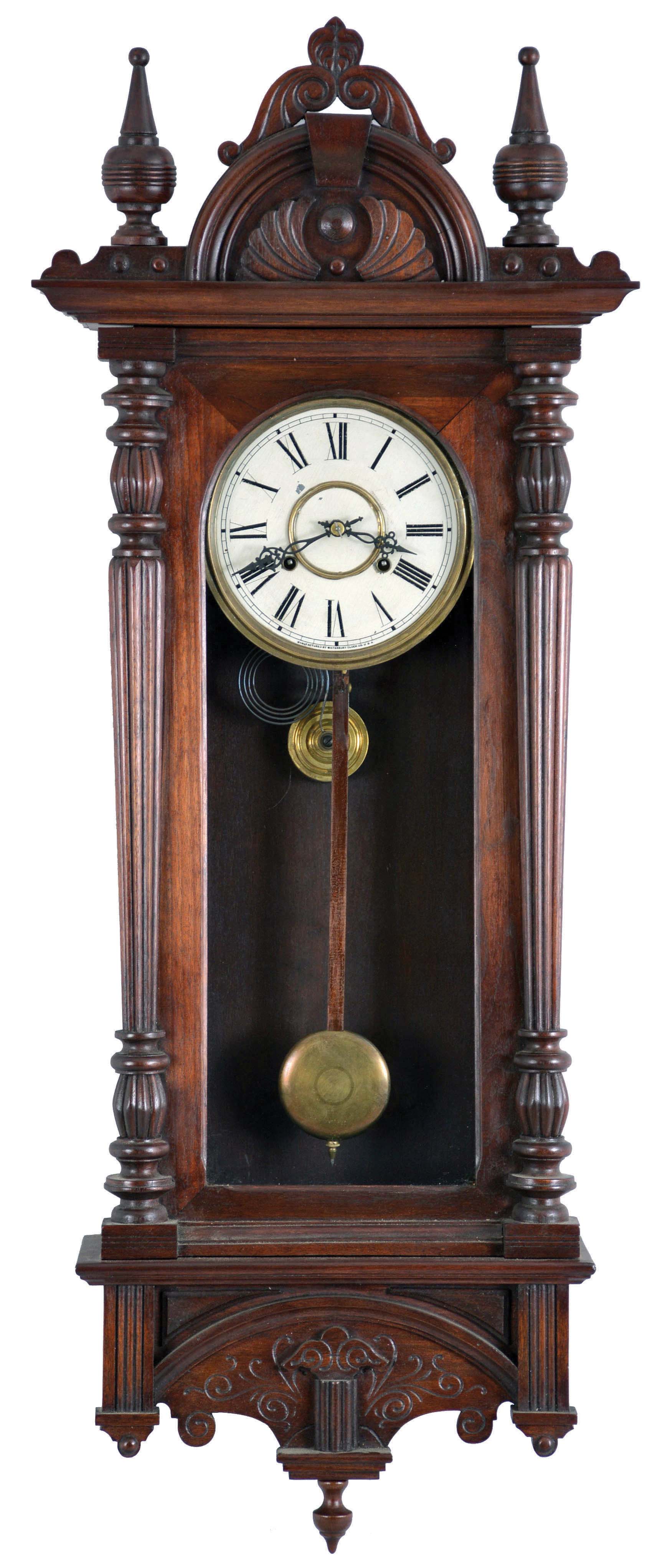 Waterbury Clock Co., Waterbury, Conn., "Leipsic" wall clock, with walnut case, Roman numeral painted dial, fancy pierced hands, and 8 day, spring driven time and strike movement — Antique Clocks Price Guide